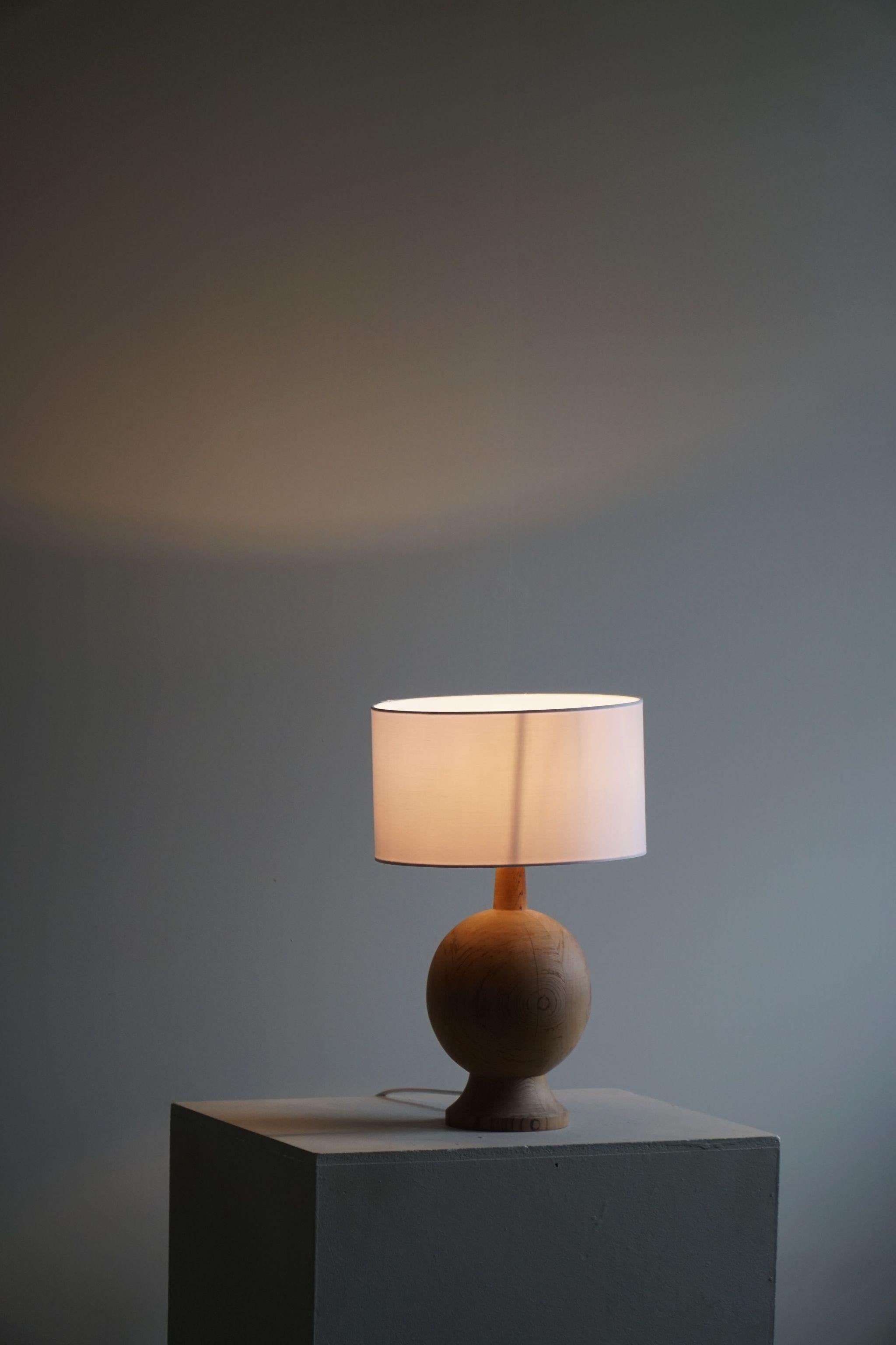 20th Century Danish Mid Century Modern, A Round Wooden Table Lamp in Solid Pine, 1960s For Sale