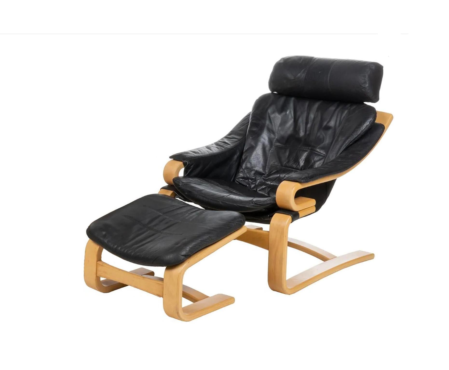 Danish Mid-Century Modern Apollo lounge chair with Ottoman by Svend Skipper for Skippers Mobler. Has soft black leather upholstery supported on Blonde Birch bentwood frames ending in sled legs. Labeled and marked skipper Mobler. The chair comes with