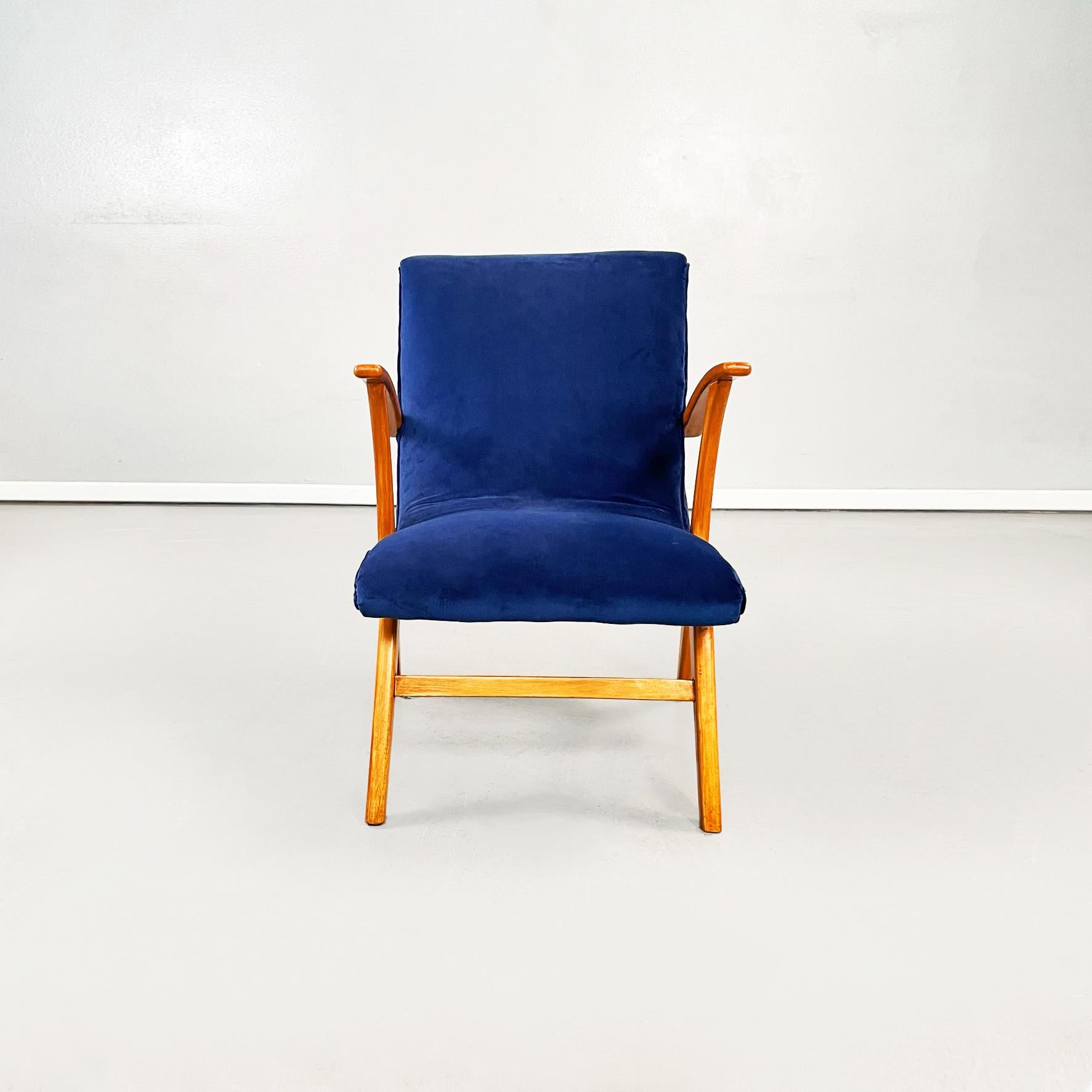 Danish Mid-Century Modern armchair in blue velvet and solid wood, 1960s
2 Armchairs ara available.
Elegant armchair with padded seat and back upholstered in blue velvet. The armrests and the legs are in light solid wood.
From 1960s These