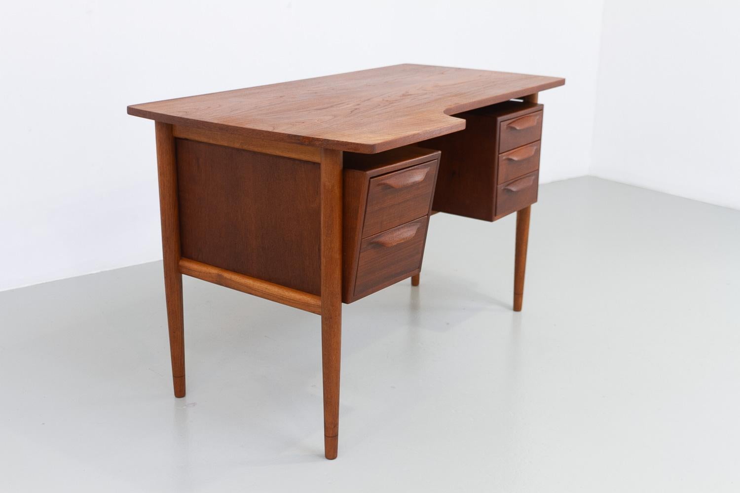 Scandinavian Modern Danish Mid-Century Modern Asymmetrical Teak Desk, 1950s. For Sale