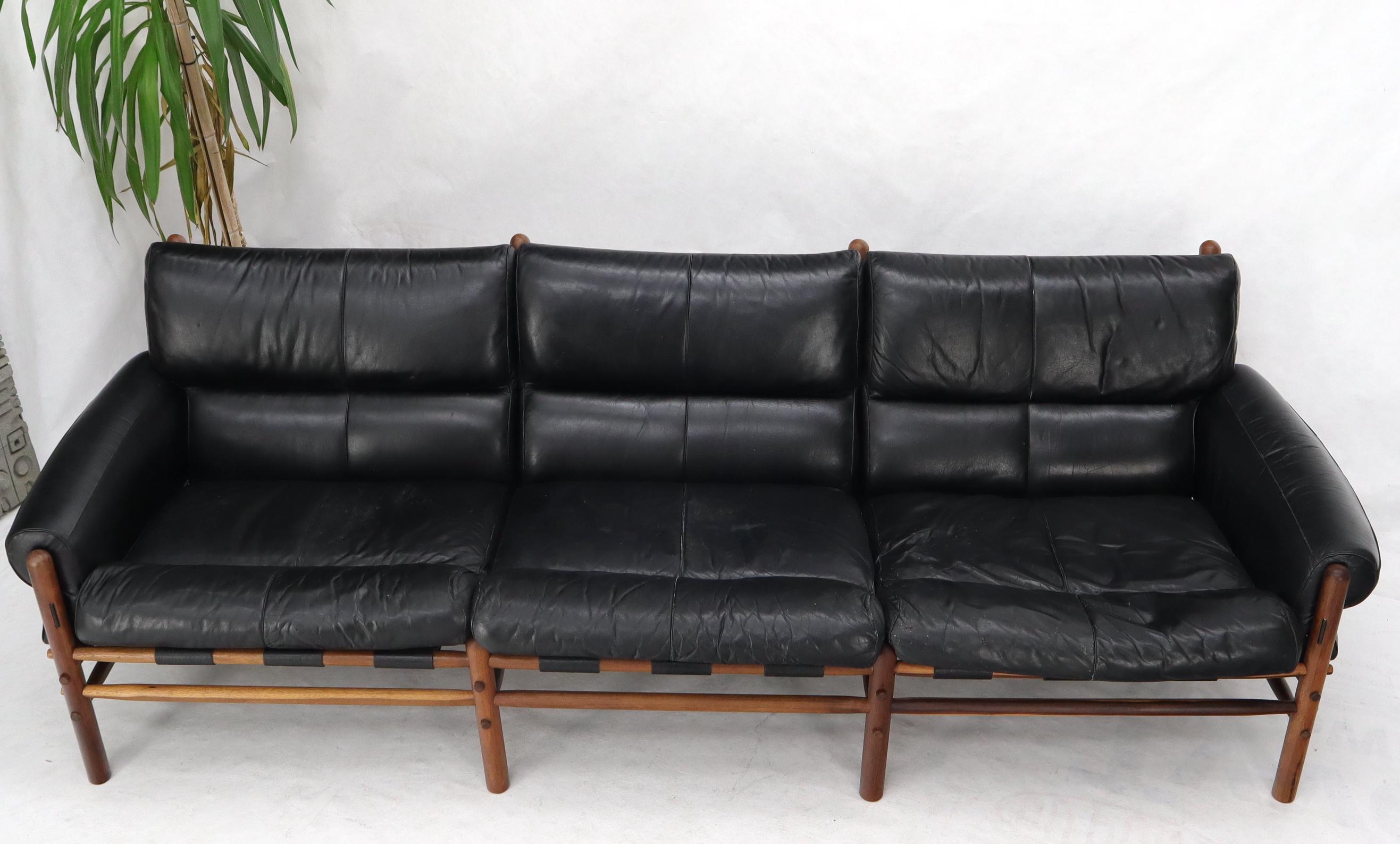 black leather mid century sofa
