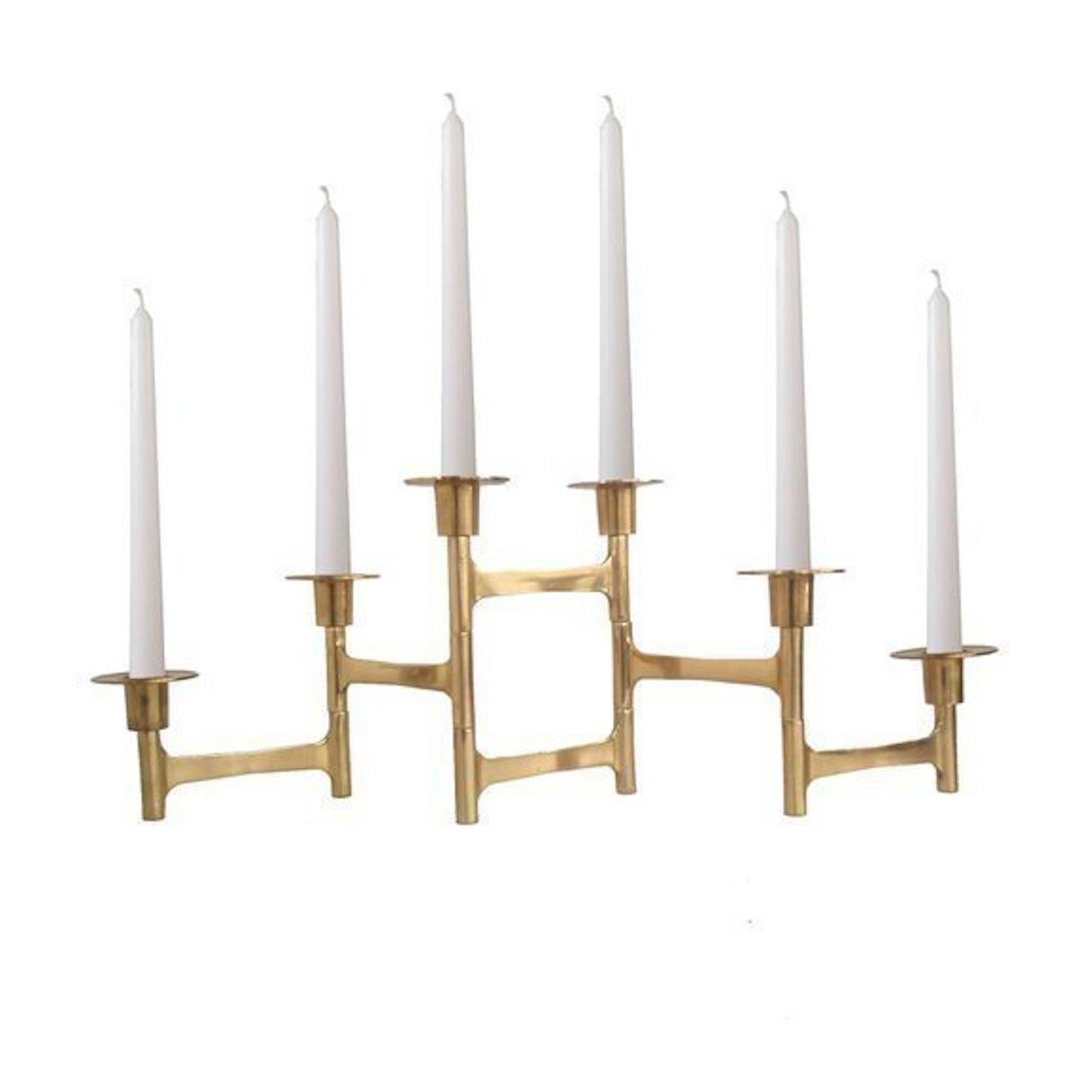 Midcentury Danish brass articulating candle holders.
Five articulated arms, each arm measures 4.5 inches in length, entire candleholder measures 22.5 inches when fully extended.
The taller holders measure 6.5 inches high while the smaller ones on