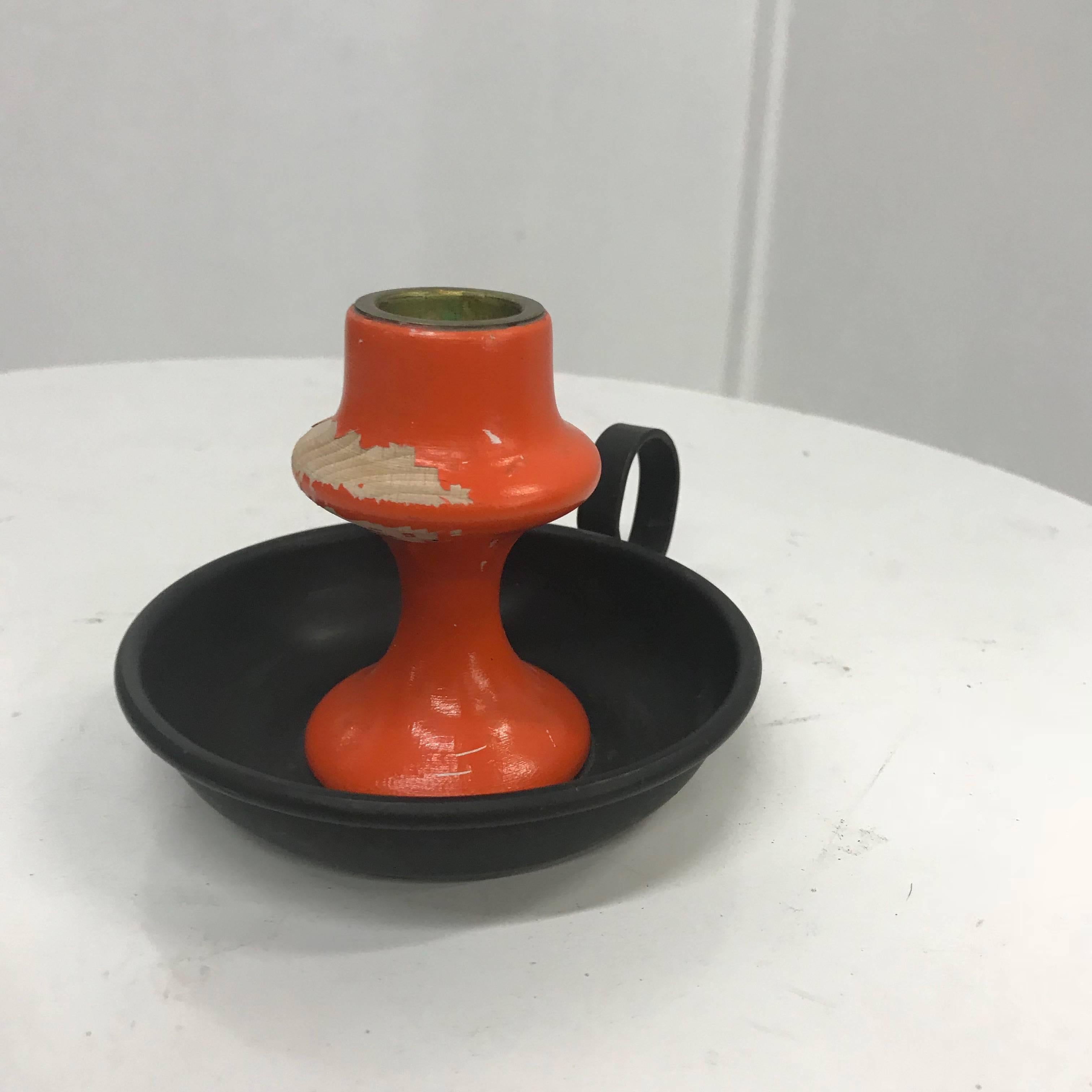 For your consideration a vintage candle holder. 
Made in Denmark. Wood painted in orange with the original metal base.
Stamped with makers label underneath.
Dimensions: 3