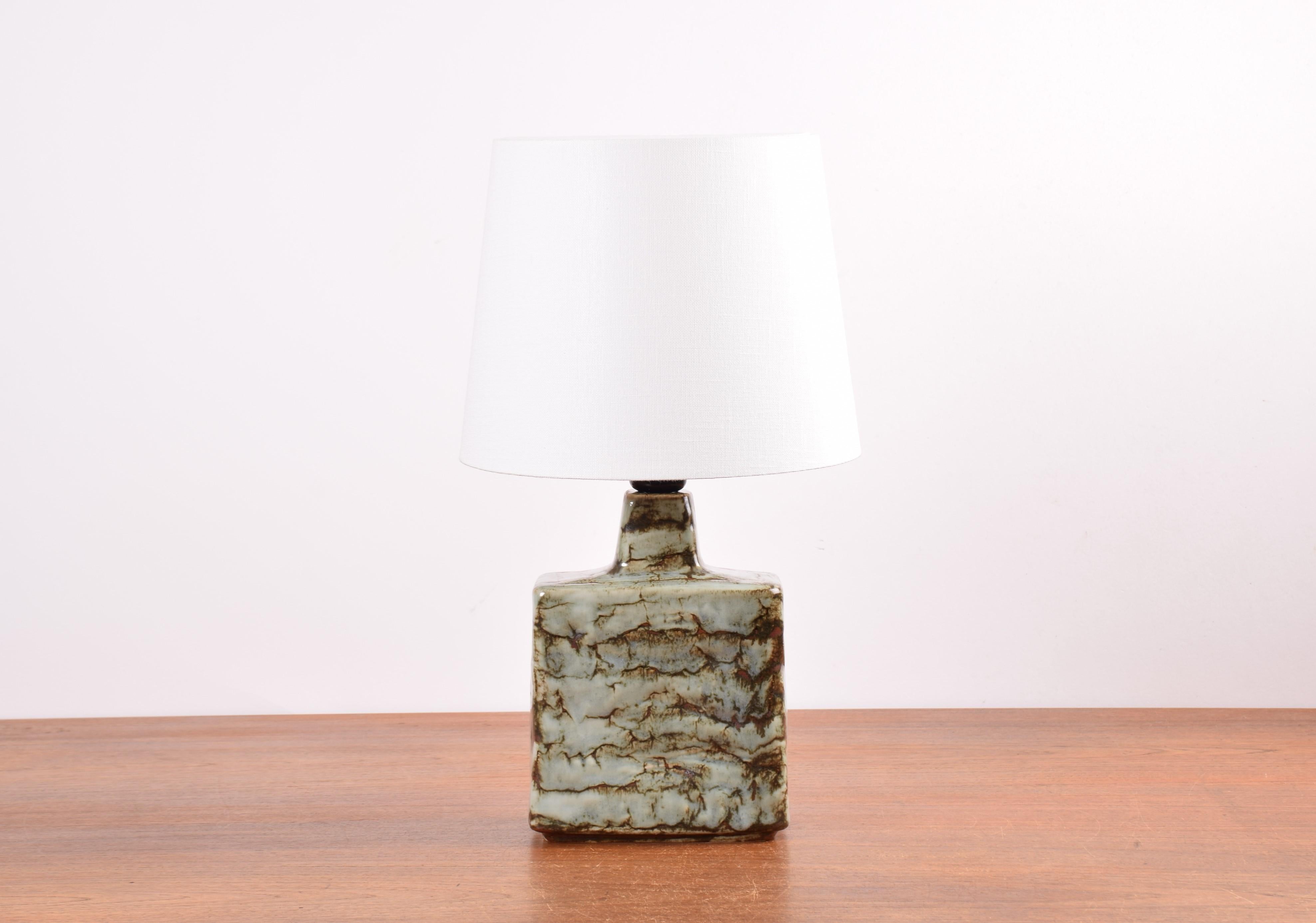Midcentury Danish ceramic table lamp from stoneware manufacturer Desiree Stentøj, made circa 1970s.
It is inspired by the Brutalist style with its simple geometric shape, great glaze expression and the structured, tactile surface.

On verso