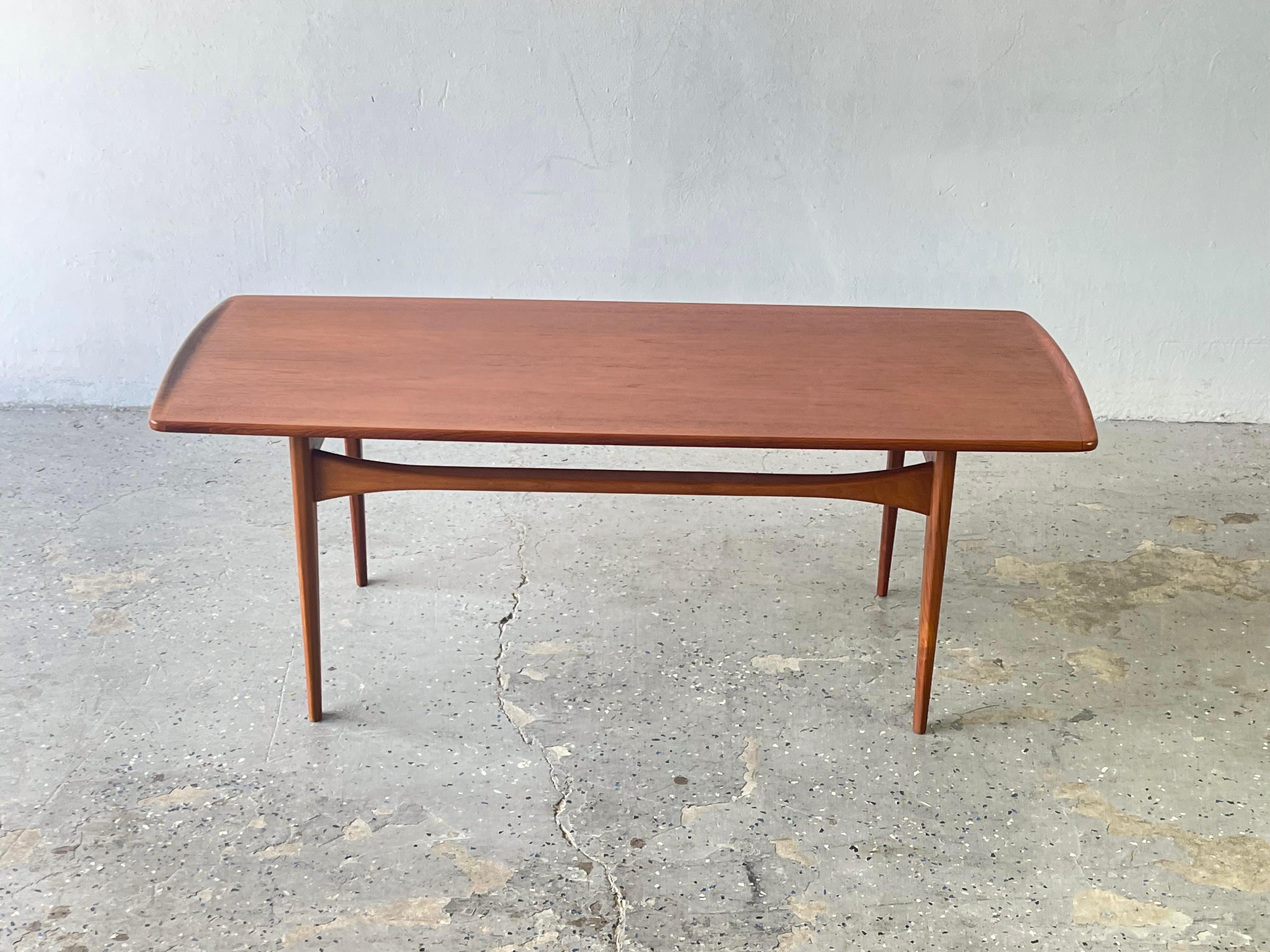Danish Modern FD 503 teak coffee table by Tove & Edvard Kindt-Larsen for France & Søn.

This gorgeous teak coffee table with sleek lines and solid construction was manufactured in Denmark 1962-1963. Designed by Tove & Edvard Kindt Larsen model FS