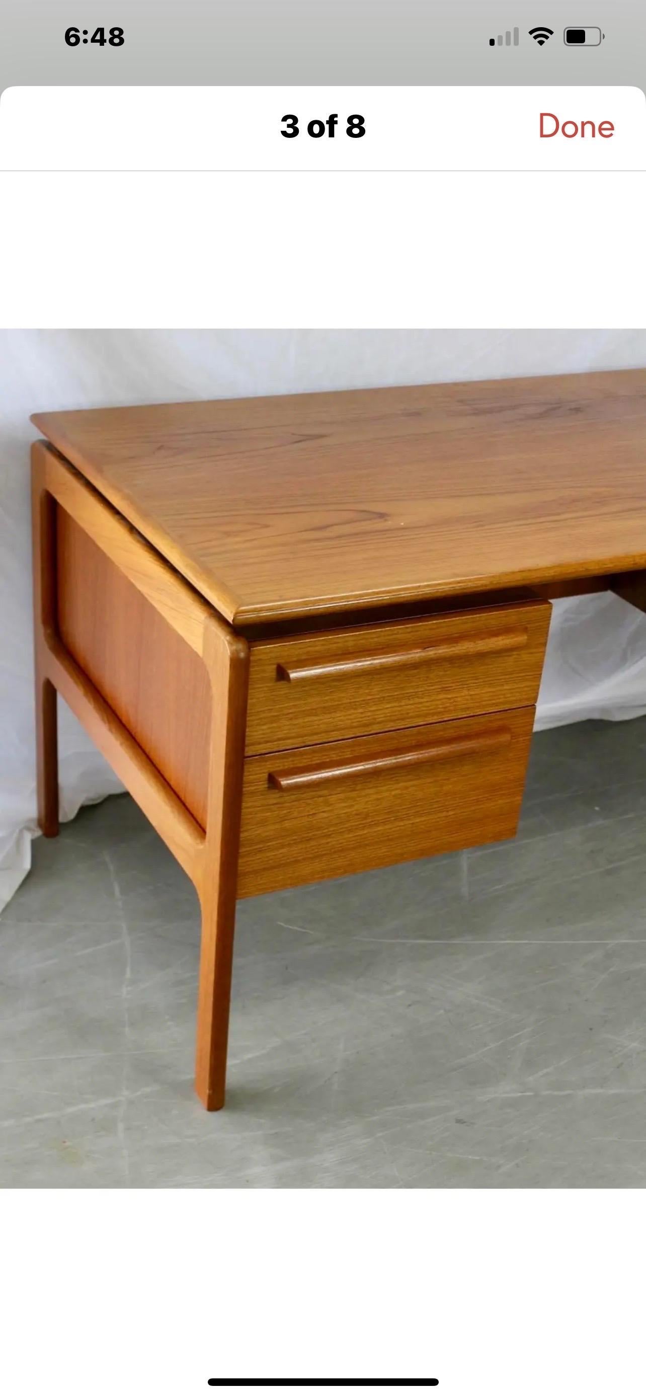 Mid Century Danish Modern floating desk by Danflex Systems.  Features three drawers, a file cabinet on the right side and two drawers on the left side.