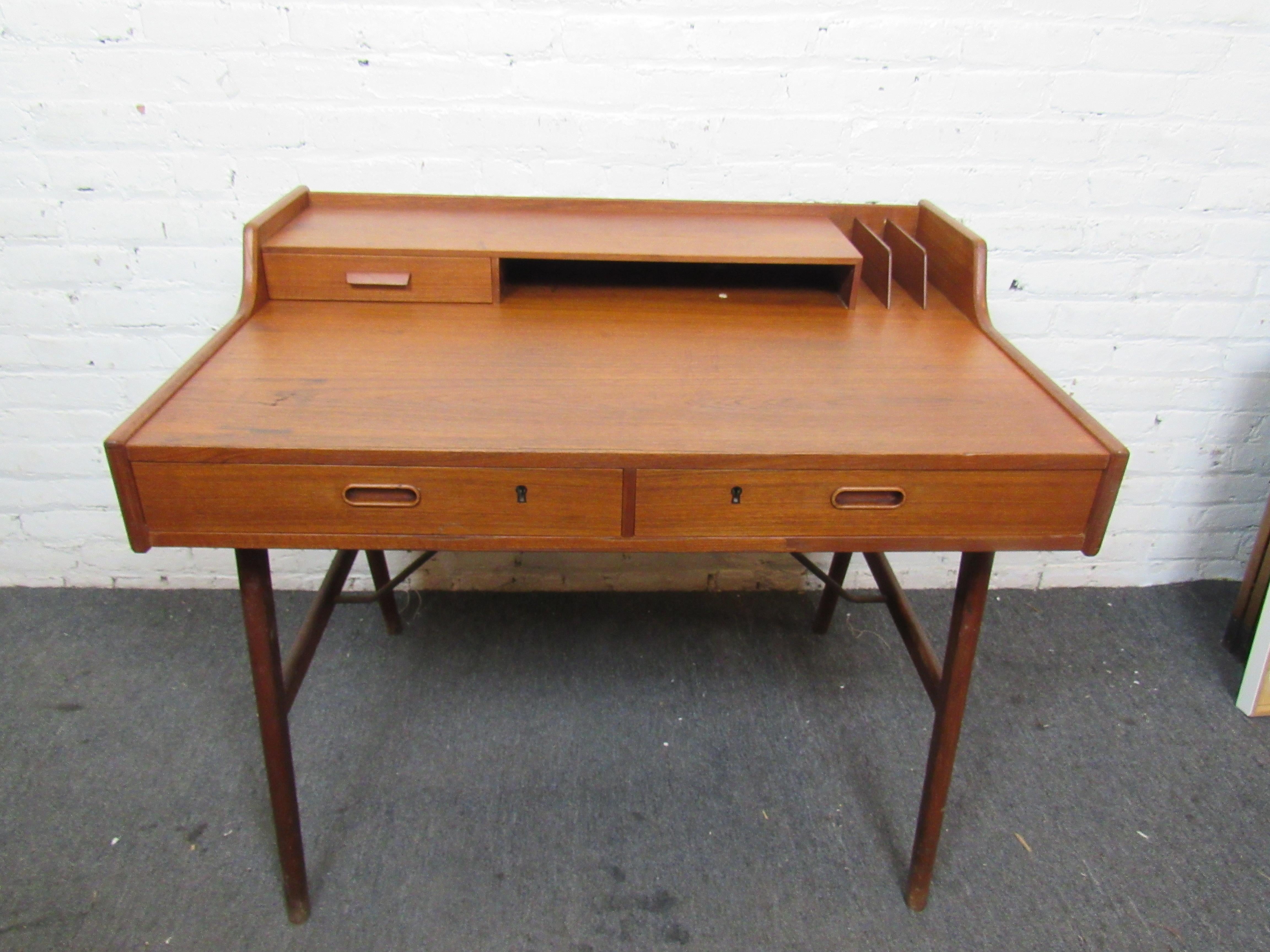 Gorgeous Danish teak desk from the 60s. Classic Mid-Century Modern design with deep desk space. 
(Please confirm item location - NY or NJ - with dealer).
 