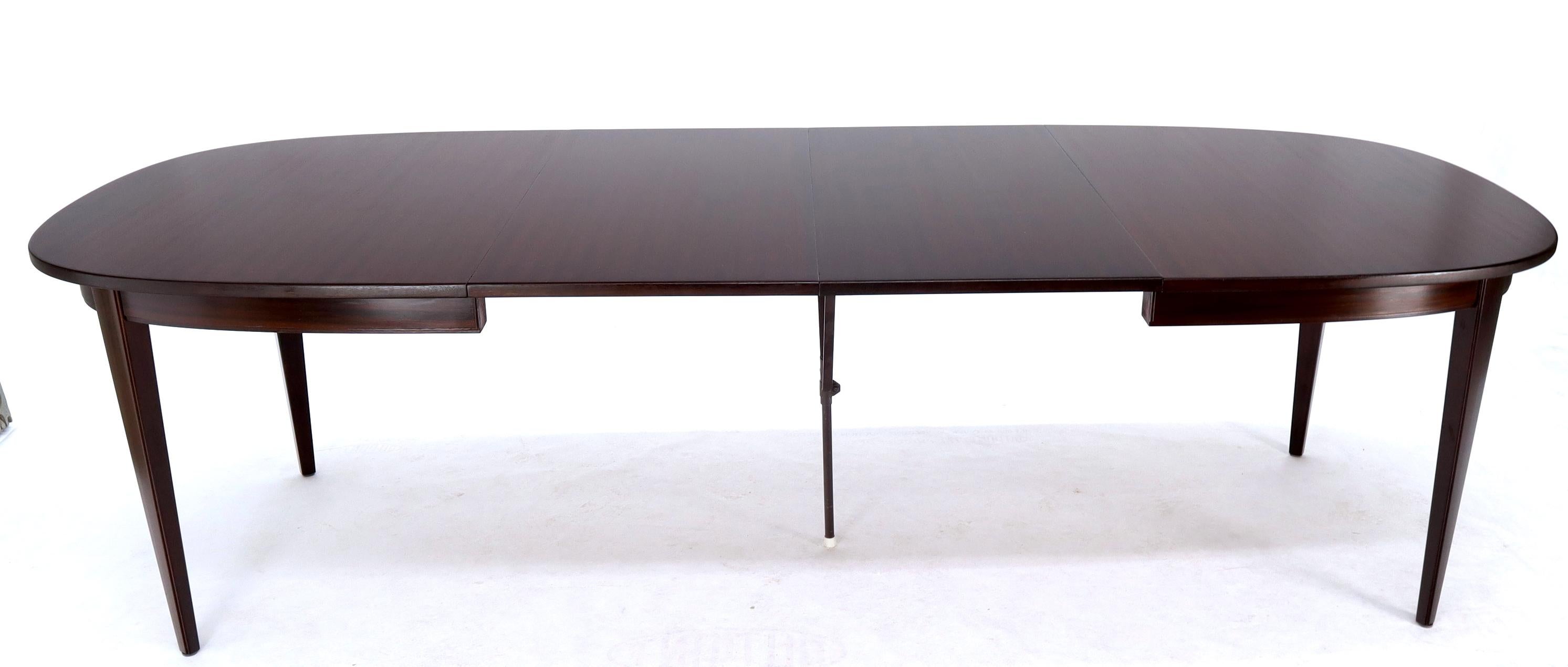 Danish Mid-Century Modern oval dining table by Omann Jun. 
Espresso mahogany finish. Comes with 2 X 20