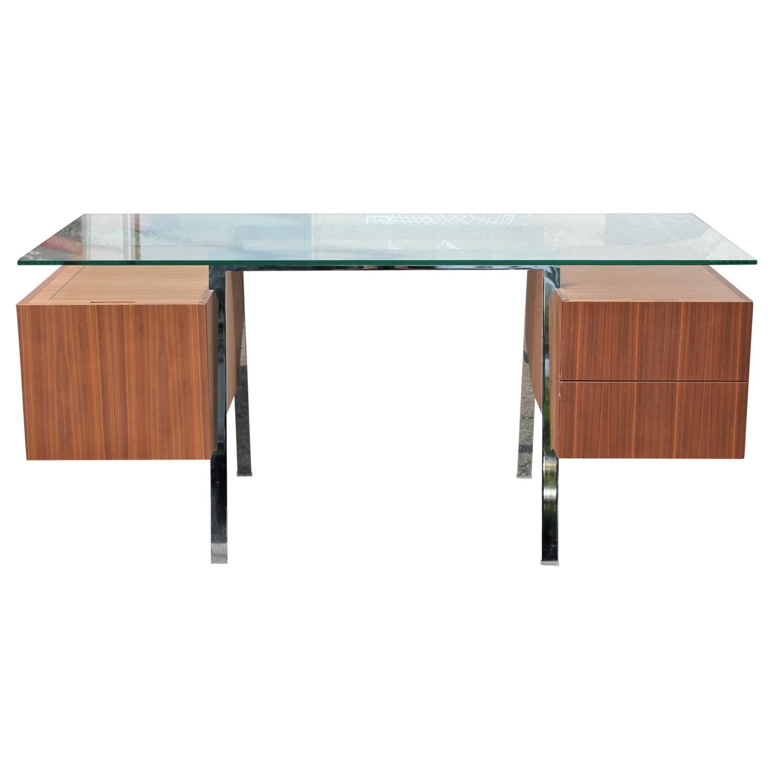 Mid-Century Modern style homework desk by Danish designer Niels Bendtsen. The piece features a glass top floating on a chrome steel frame. There are two drawers on the right and a hanging file system on the left.

Glass top dimensions: W 64 in. x