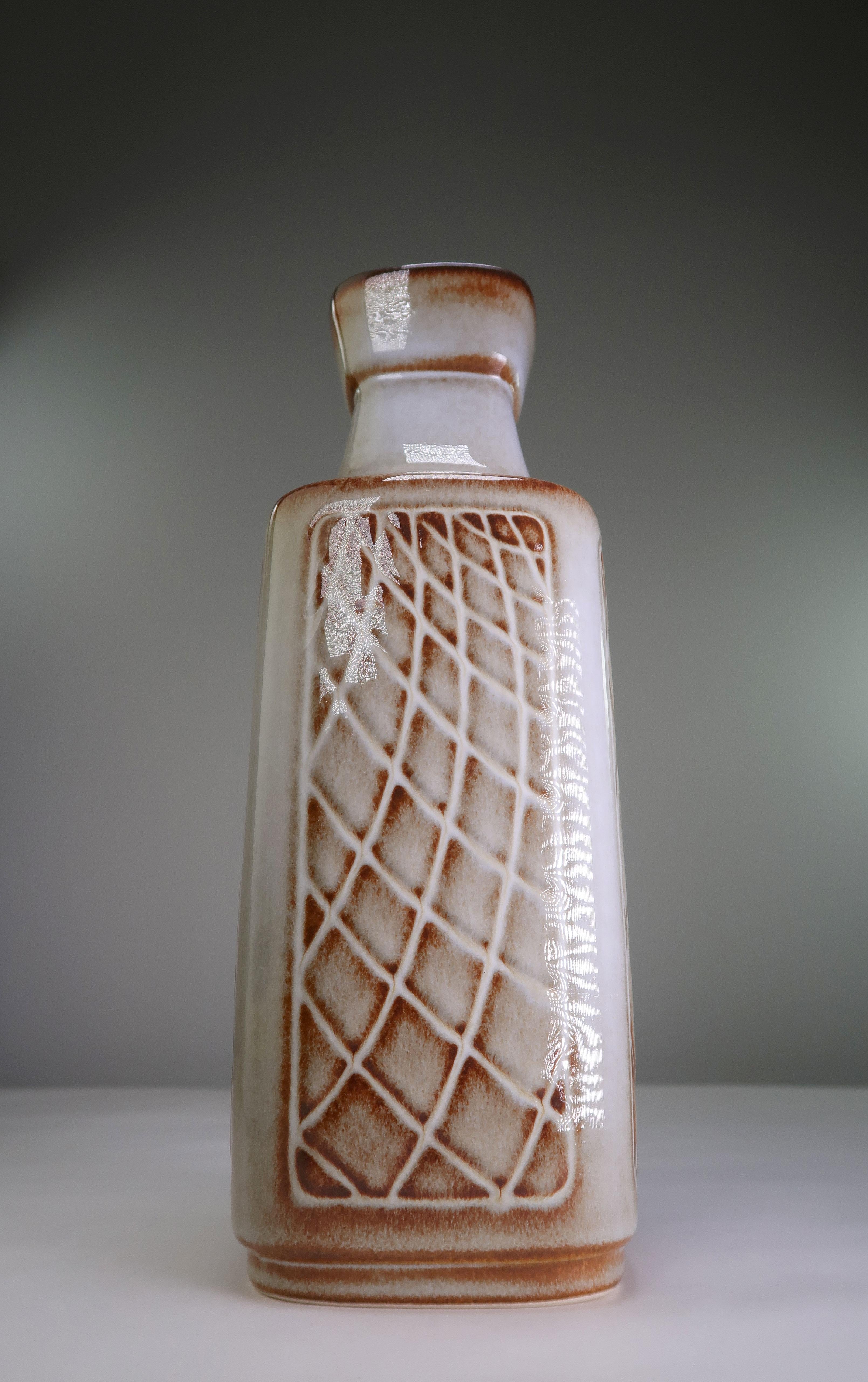 Danish Mid-Century Modern handmade and hand decorated stoneware vase by designer Einar Johansen. Grey base with brown lines accentuating the geometric pattern on all four sides. Manufactured by Soholm Pottery on the Danish island of Bornholm in the
