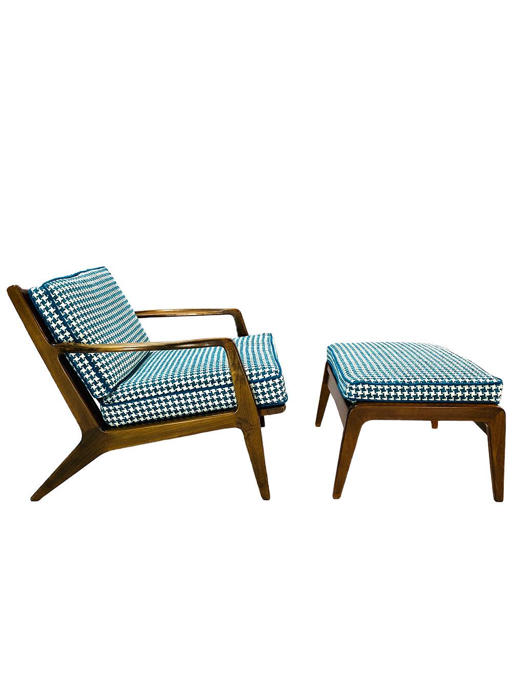 Danish Mid-Century Modern IB Kofod Larsen walnut lounge chair and ottoman recently reupholstered in blue and white houndstooth premium fabric. Cushions and under-cushion strapping are good. The woodwork has not been refinished so some scratches and