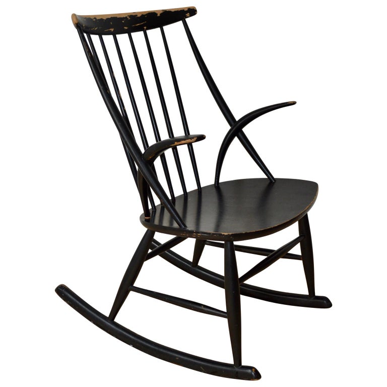 Black lacquered Illum Wikkelsø Gyngestol No.3 rocking chair manufactured by Niels Eilersen. Designed 1958. Spindle back with distinctive short, curved arms. This rocker is in great vintage condition with wear commensurate with age. With the original
