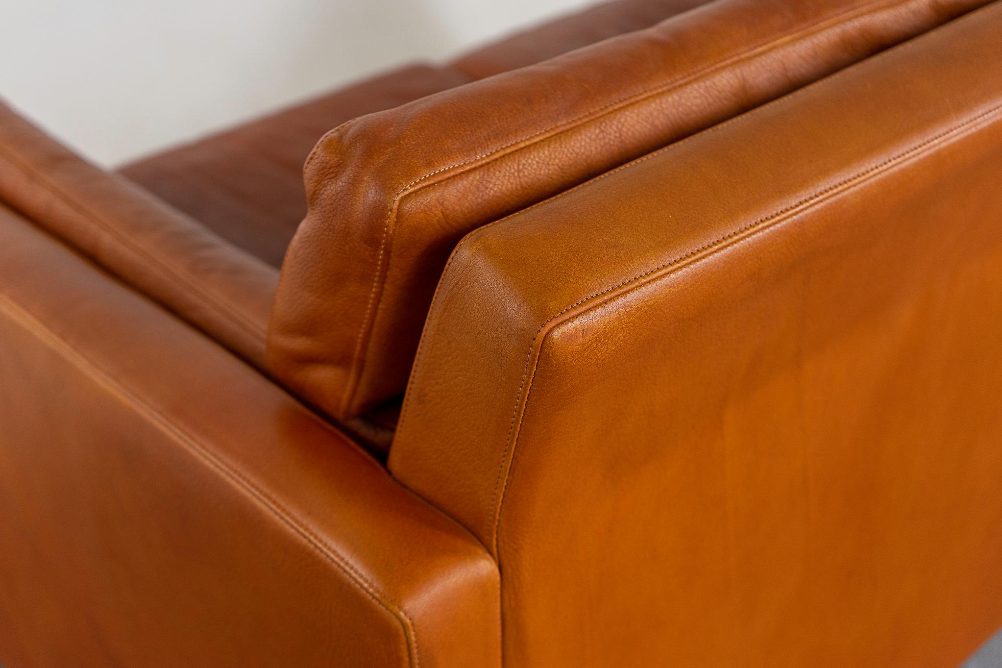 Leather loveseat circa 1960's. Original tan leather is soft and supple while also being durable to ensure years of use and enjoyment. Compact footprint for urban dwellers in cozy lofts or condos!

Please inquire for remote and international shipping