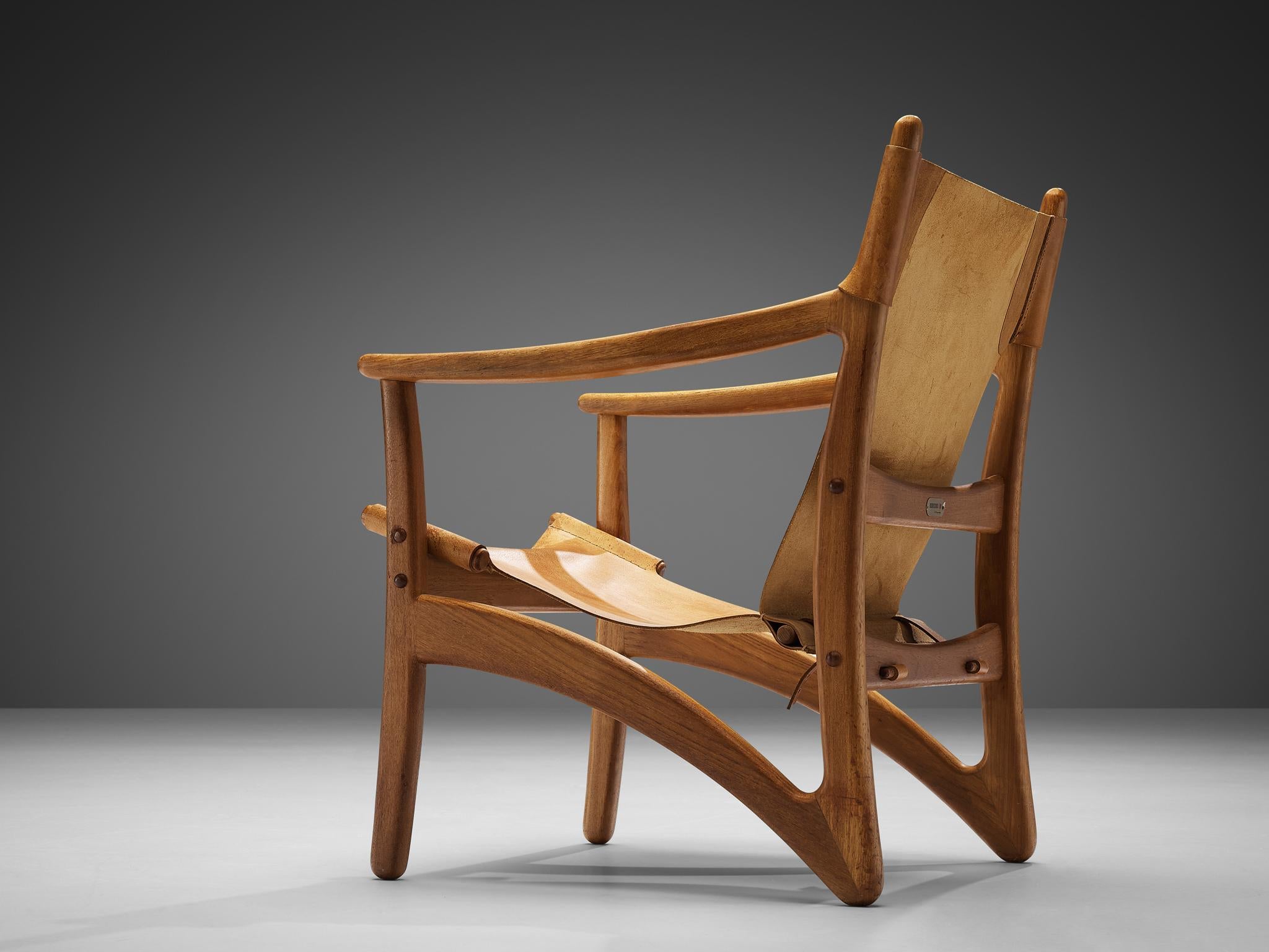 Dänischer Mid-Century Modern-Loungesessel aus Teakholz und cognacfarbenem Leder (Mitte des 20. Jahrhunderts) im Angebot