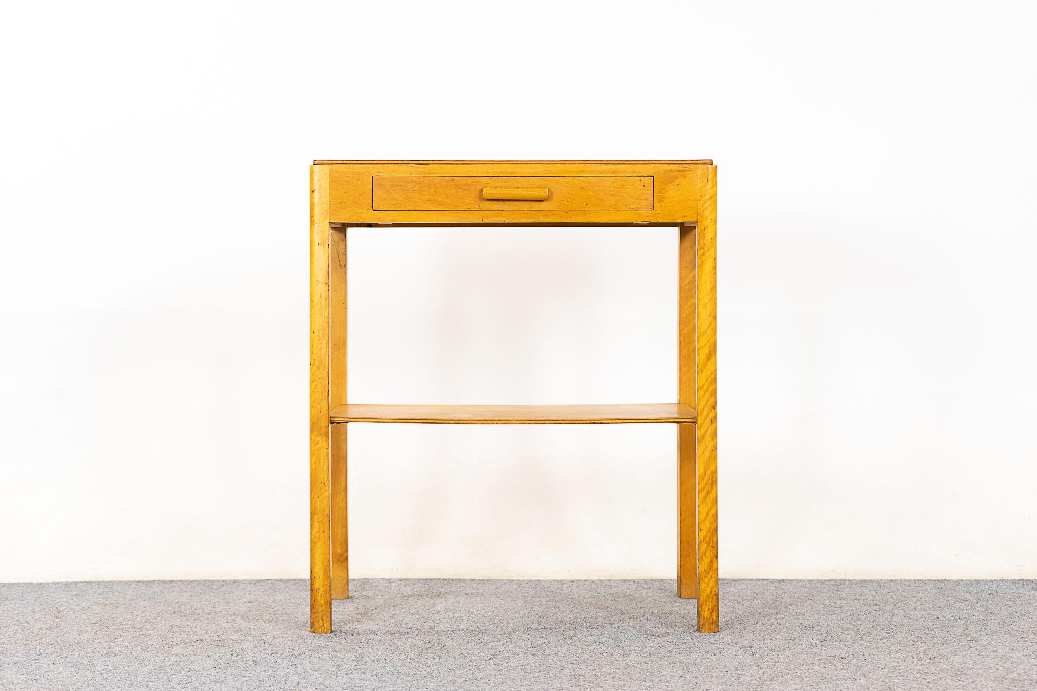 Maple mid-century bedside table, circa 1960's. Veneered case with slender legs, practicle shelf and sleek dovetailed drawer.

Unrestored item with option to purchase in restored condition for an additional $100 USD. Restoration includes: repairs,