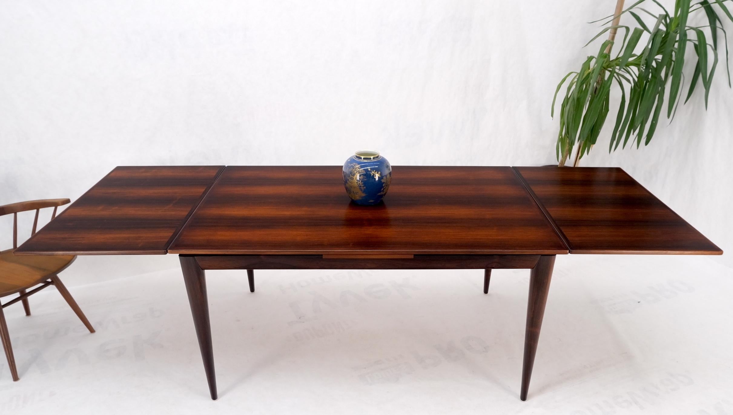 Danish Mid-Century Modern Moller solid rosewood frame refectory dining table mint!
Two leaves measuring 23 inches in width.