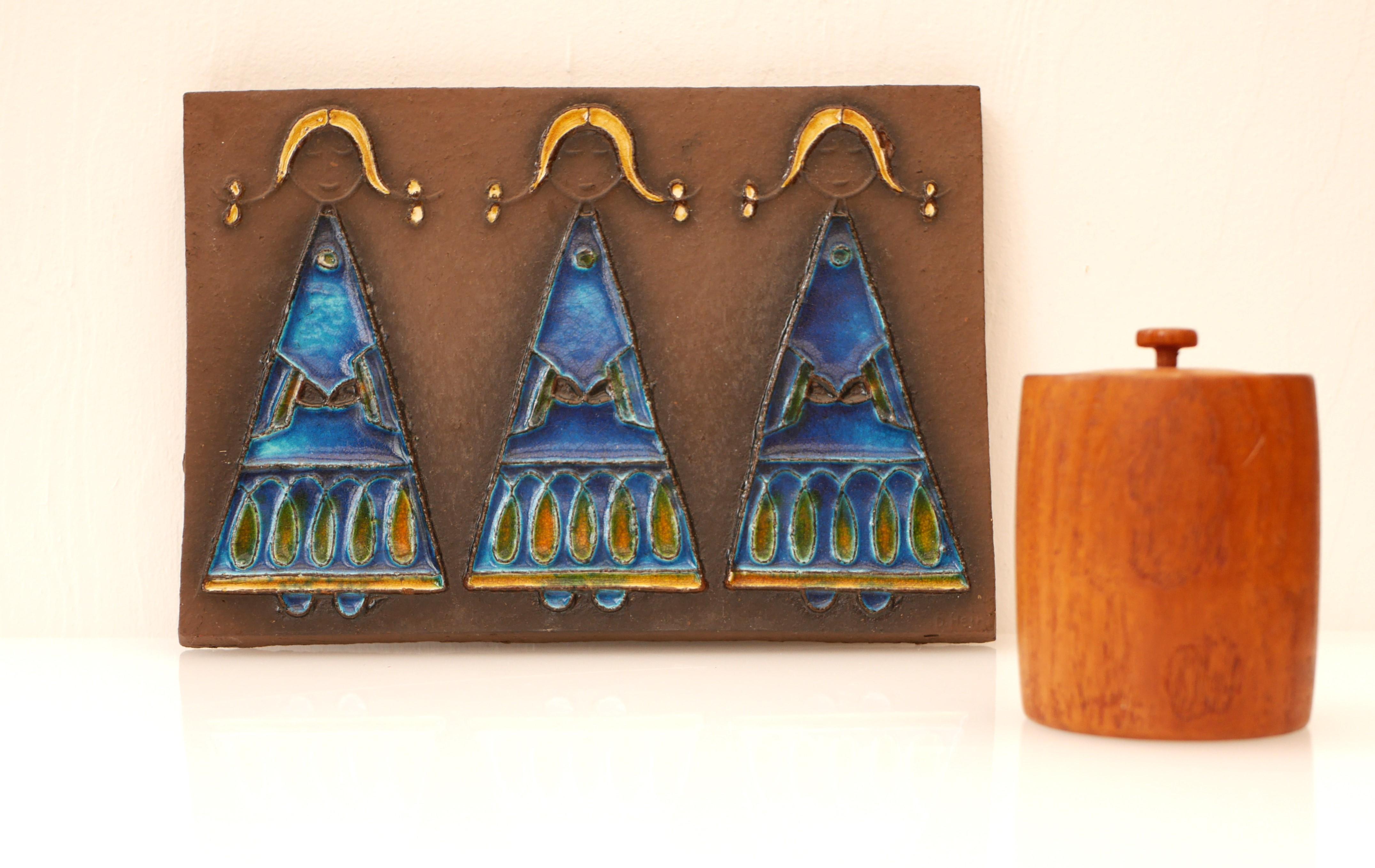 Mid-century modern signed Scandinavian art pottery wall tile decoration, a fantastic wall plaque made and signed by Dietlinde Hein Knabstrup, Denmark. This piece is known as “the Three sister” and has a very 60's feeling to it and it depicts three