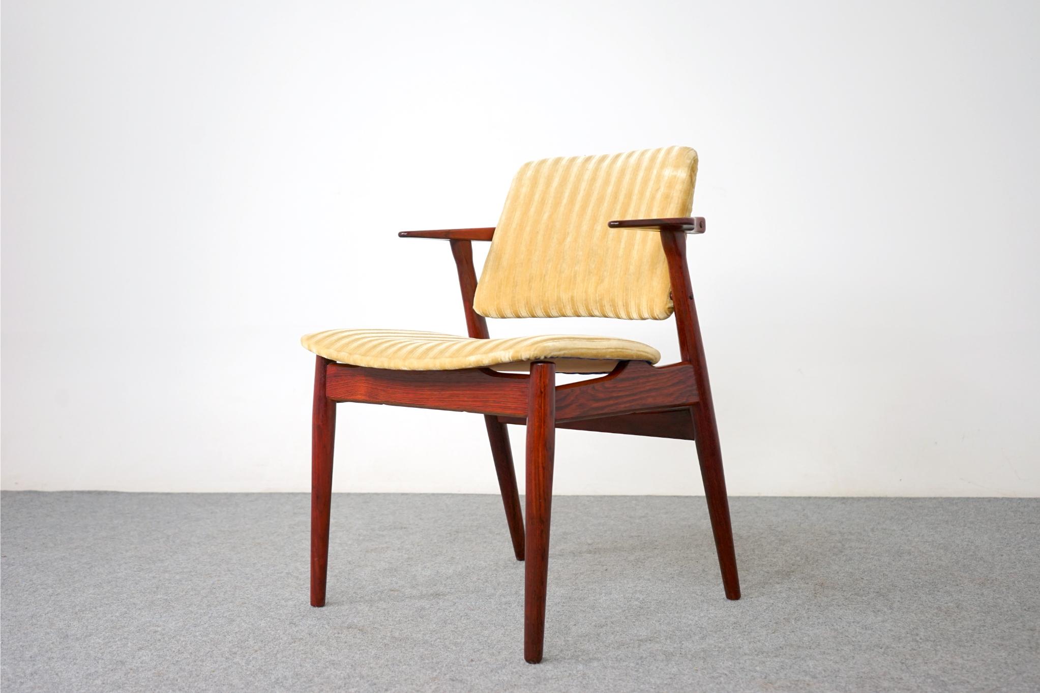 Rosewood Danish arm chair by Arne Vodder, circa 1950's. Beautifully sculpted frame with stunning lines, comfort without an imposing footprint! Floating seat and back offer a light elegant feel. Original striped yellow velvet upholstery, brighten up