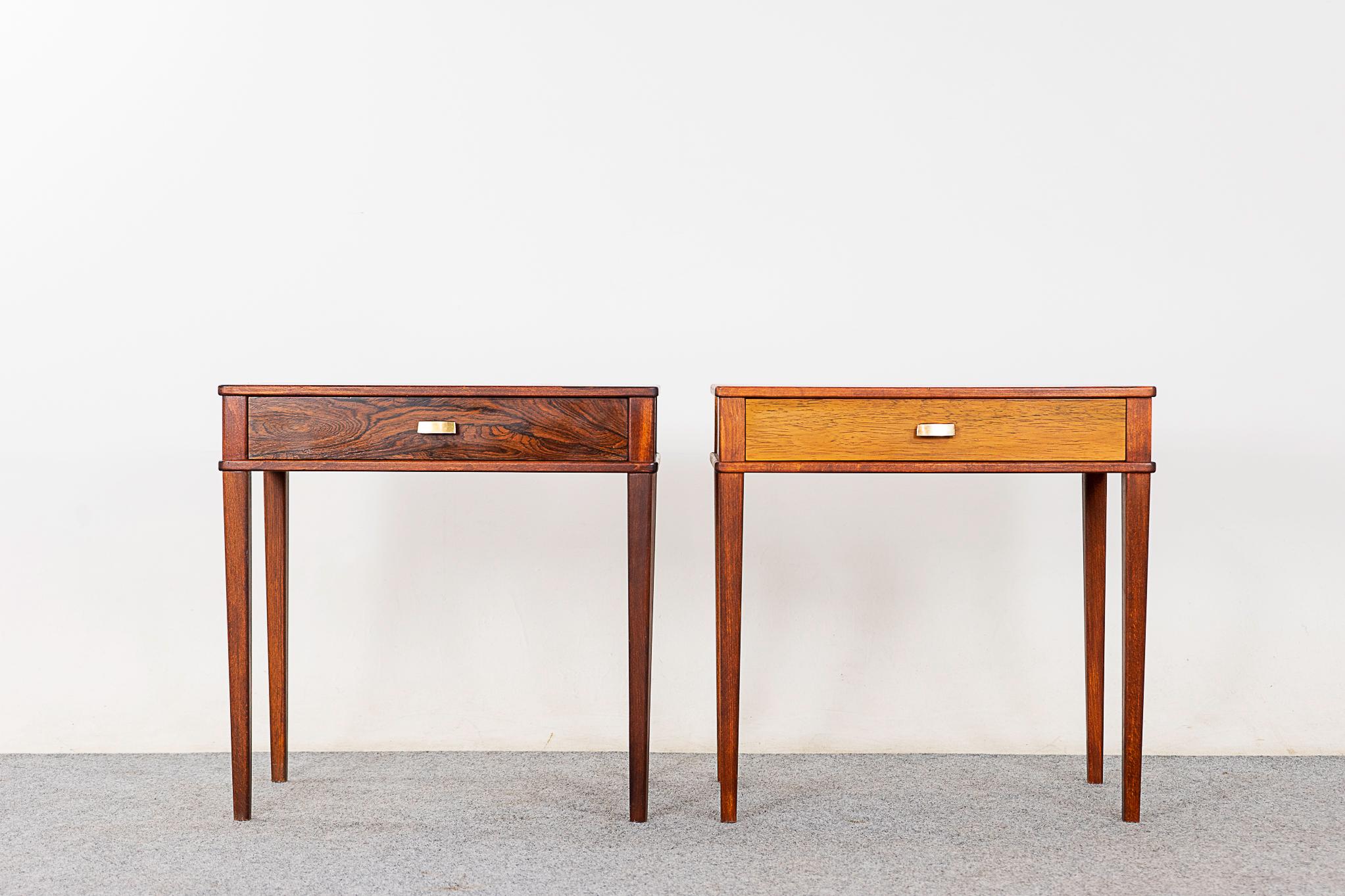 Rosewood mid-century bedside pair, circa 1960's. Veneered case on slender legs, sleek drawer and contrasting metal pulls!

Please inquire for remote and international shipping rates.
