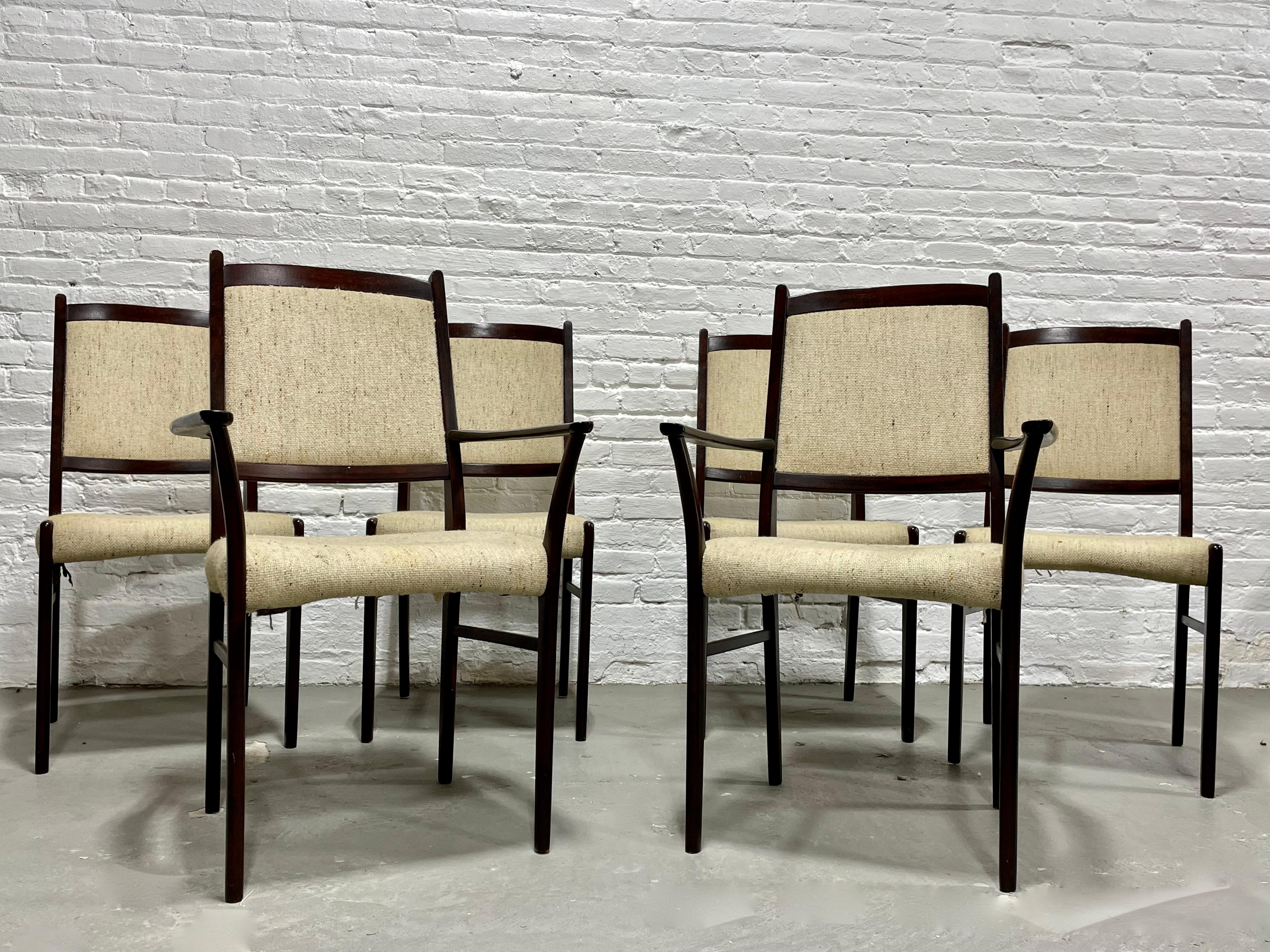 Set of Six Danish Mid-Century Modern rosewood dining chairs, circa 1960s. Simple, clean lines + perfect design featuring lovely oatmeal upholstery. Constructed in rosewood and its deep, rich color and stunning wood grains will add depth and design