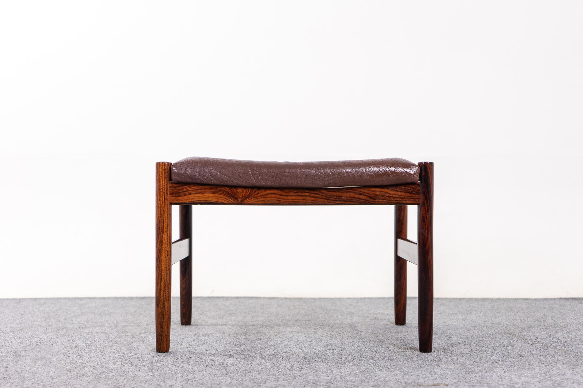 Rosewood Danish modern footstool by Spottrup, circa 1960's. Clean, modern compact design can be used with virtually any seating type. Easy to move around the home. Spottrup maker's mark intact. Rest your tired feet.

Please inquire for international