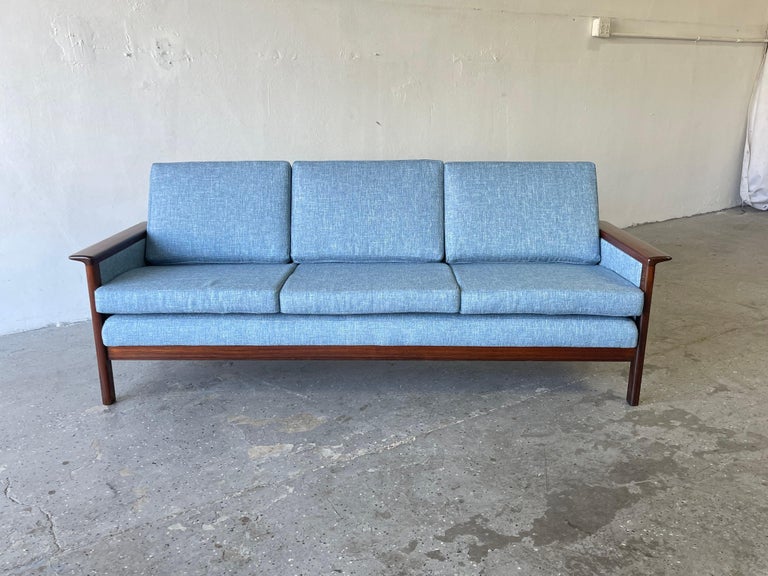 Danish modern sofa and By Westnofa out of Norway The frame is made of solid rosewood and has a beautiful woodgrain. 

Professionally refinished and reupholstered in tweed.
Overall 75 inches wide 27 inches deep 30 inches high.

Measures: Seat 16
