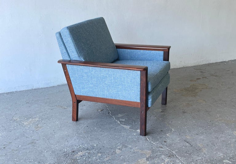 Danish modern armchair by westnofa out of Norway.
 The frame is made of solid rosewood and has a beautiful woodgrain 

Professionally refinished and reupholstered in tweed

Measures: Chair Overall 28 inches wide 27 inches deep 30 inches high