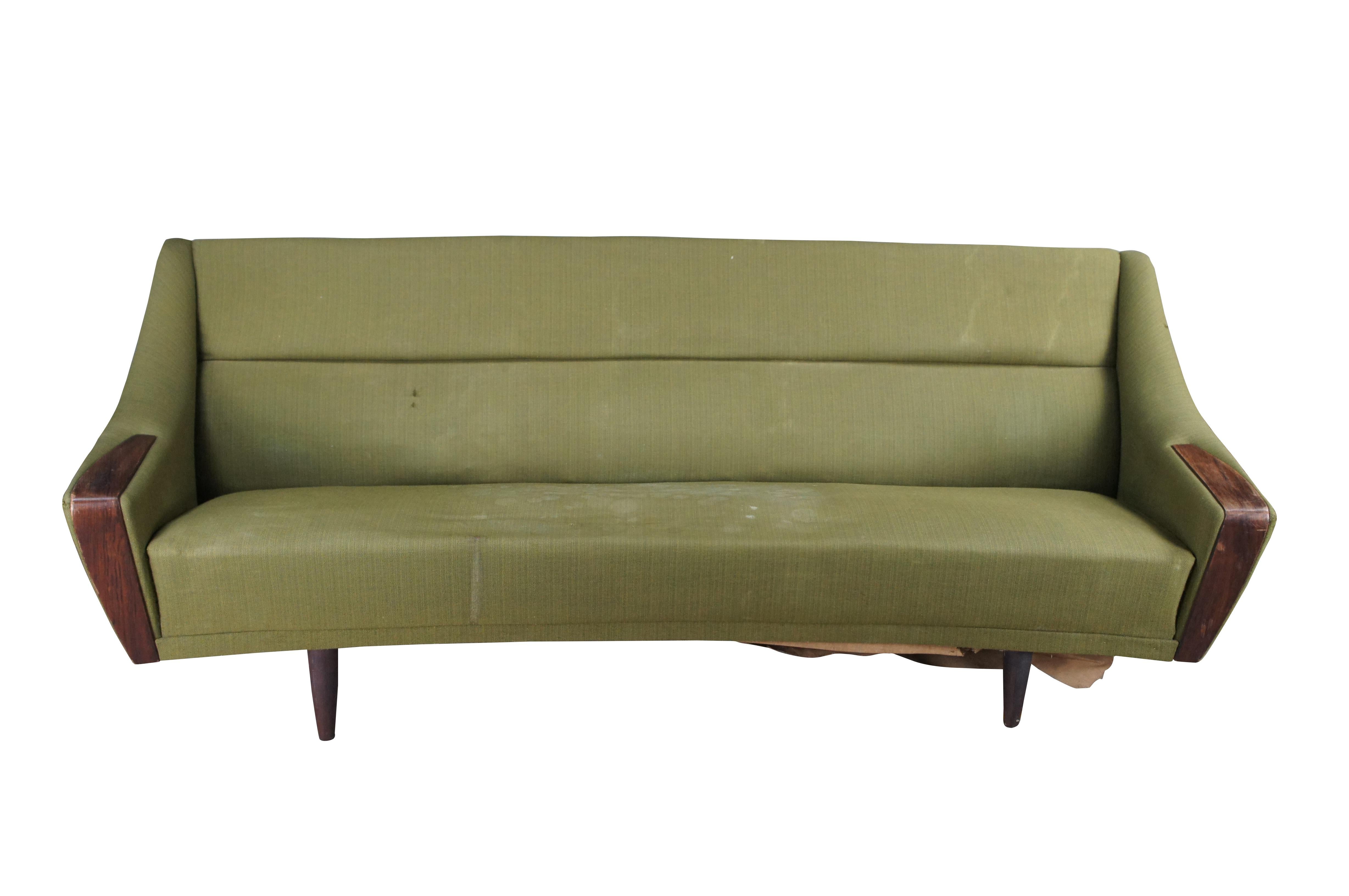 Rare mid century modern Severin Hansen sofa / couch or love seat featuring a bow front shape with rosewood arm rests and tapered legs.

Severin HANSEN

Severin Hansen, a renowned Danish designer, left his mark on the world of design in the mid-20th