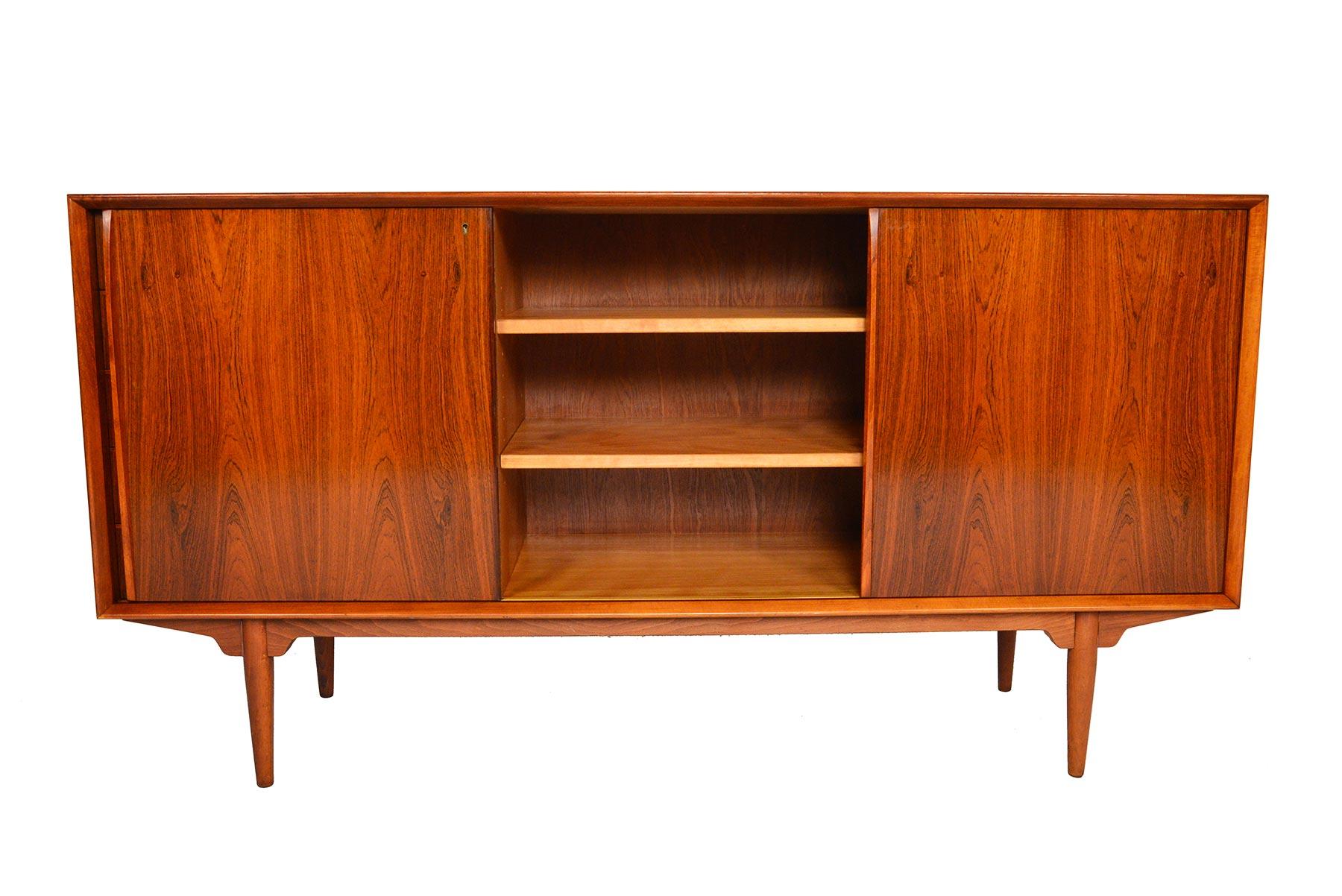 This Swedish modern 'Silva' model midcentury rosewood credenza was designed by Svante Skogh in the 1960s. This piece features a unique locking mechanism. When the key is turned to the locking position, the cabinet doors and the drawers are