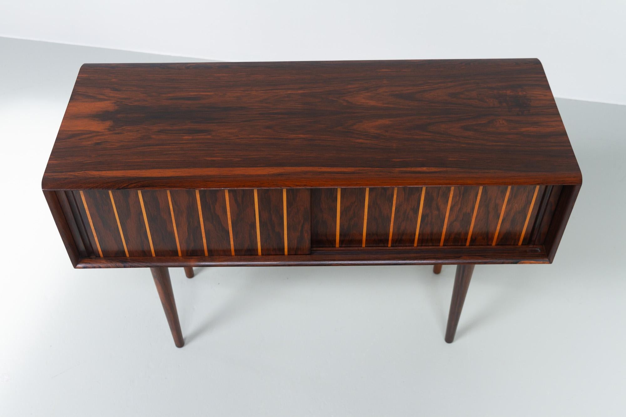 Danish Mid-Century Modern Small Rosewood Sideboard, 1950s.
Very lovely and exquisite small Danish design chest, most likely made Danish cabinetmaker L. Chr. Larsen & Søn, Denmark in the 1950s. But also sometimes attributed to Max Rasmussen, Odense.