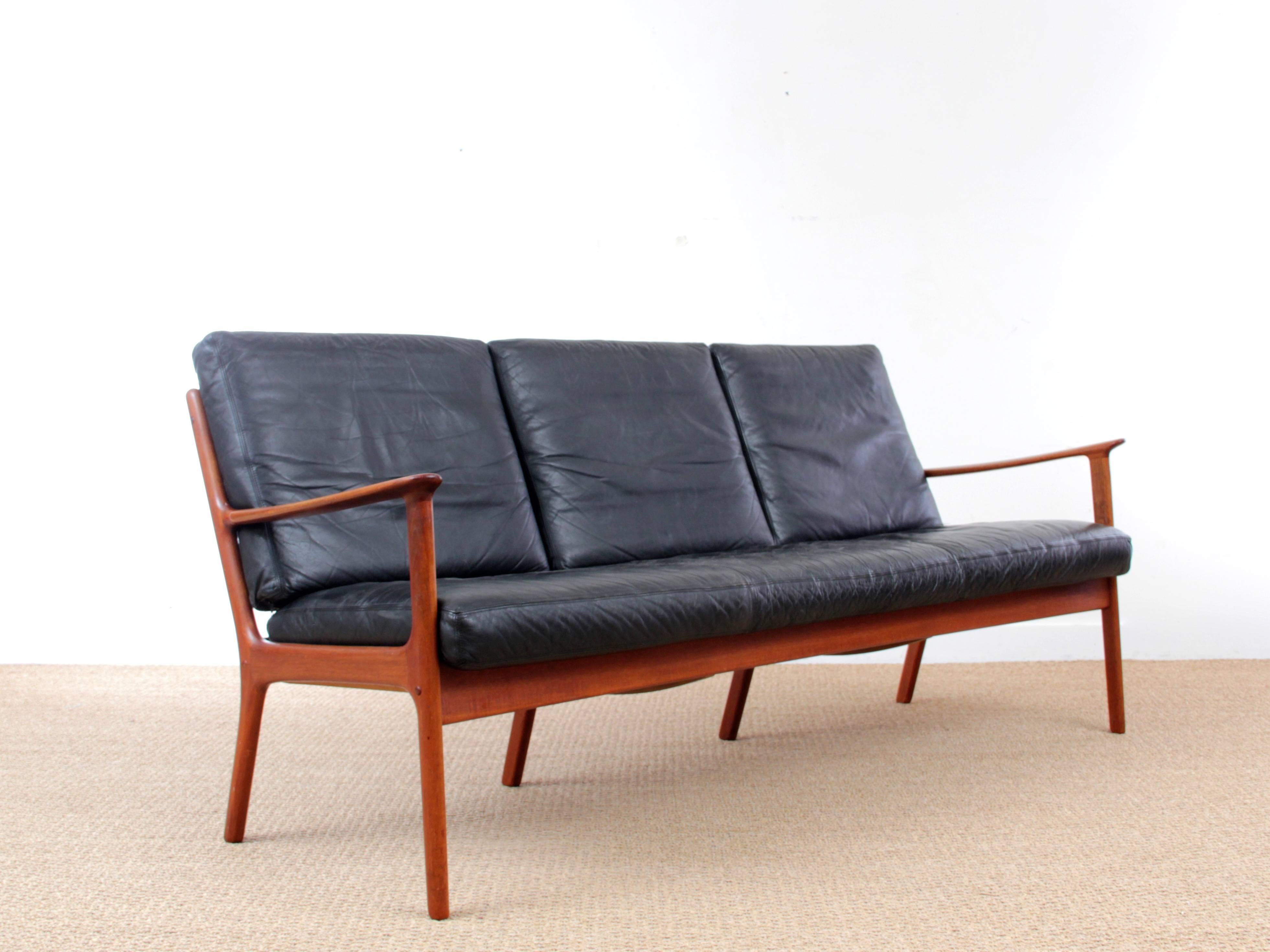 Danish Mid-Century Modern sofa three-seats by Ole Wanscher for Paul Jepesen in solid teak. Original black leather cushions. Referenced by the Design Museum Danmark under number RP02694.