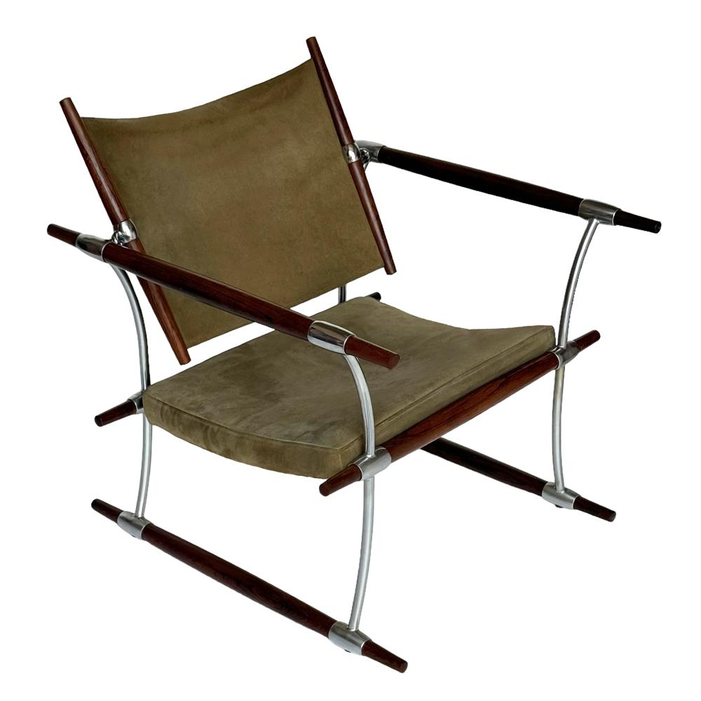 Uncommon lounge chair designed by Jens Quistgaard for Nissen Langaa in Denmark circa 1960's. Features a rosewood & aluminum frame with original olive suede cushions. All in all in great all original condition. 