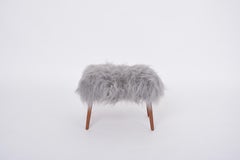 Danish Mid-century Modern stool reupholstered in grey sheep skin