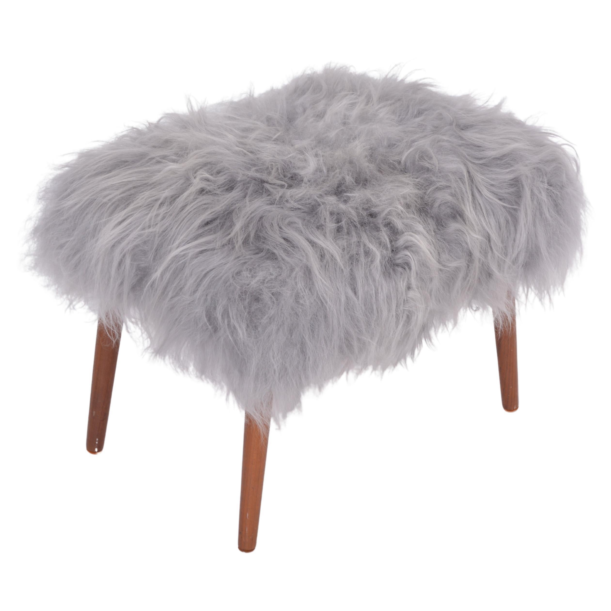 Danish Mid-century Modern stool reupholstered in grey sheep skin