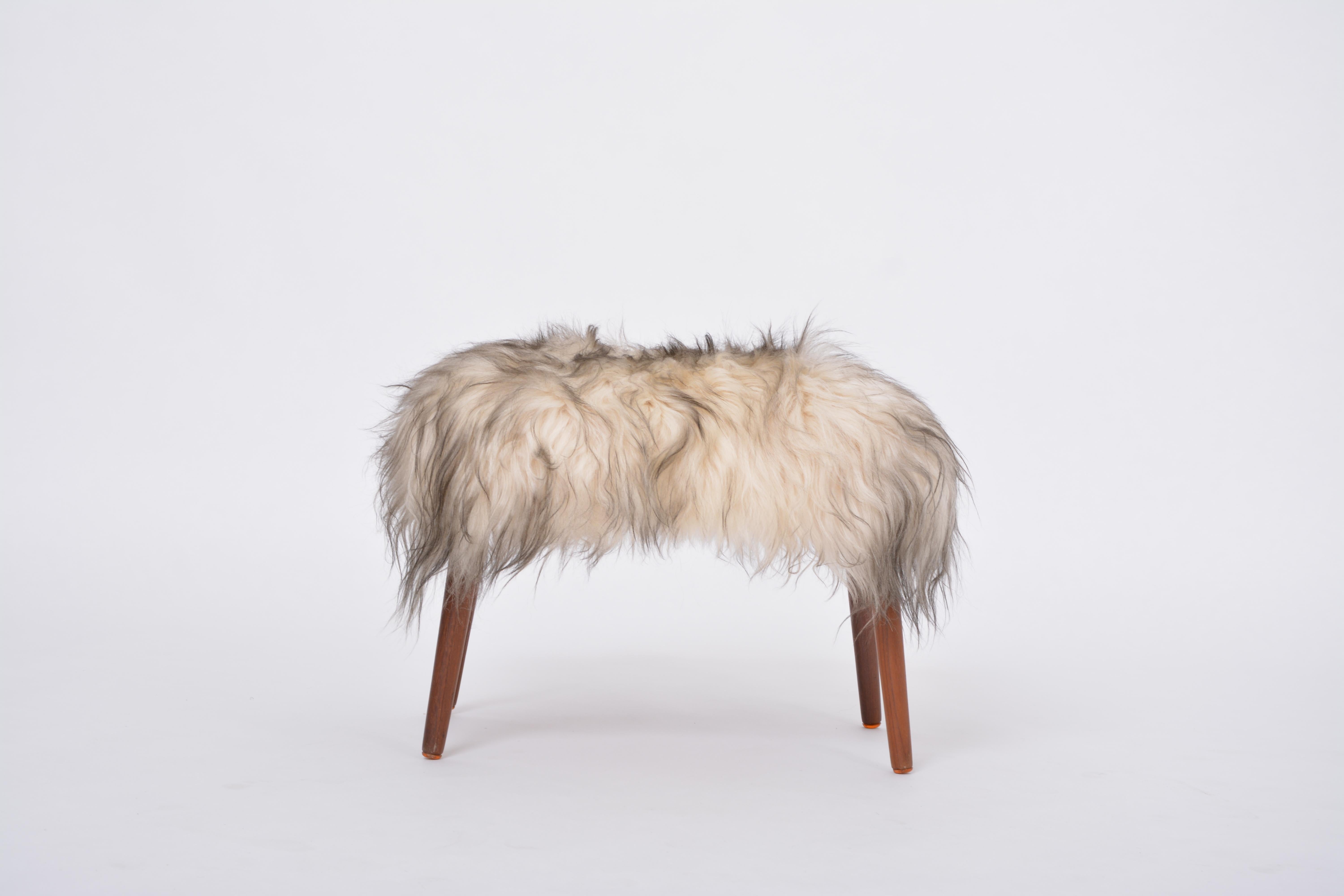 Mid-Century Modern Danish Mid-century Modern stool reupholstered in white and black sheep skin For Sale