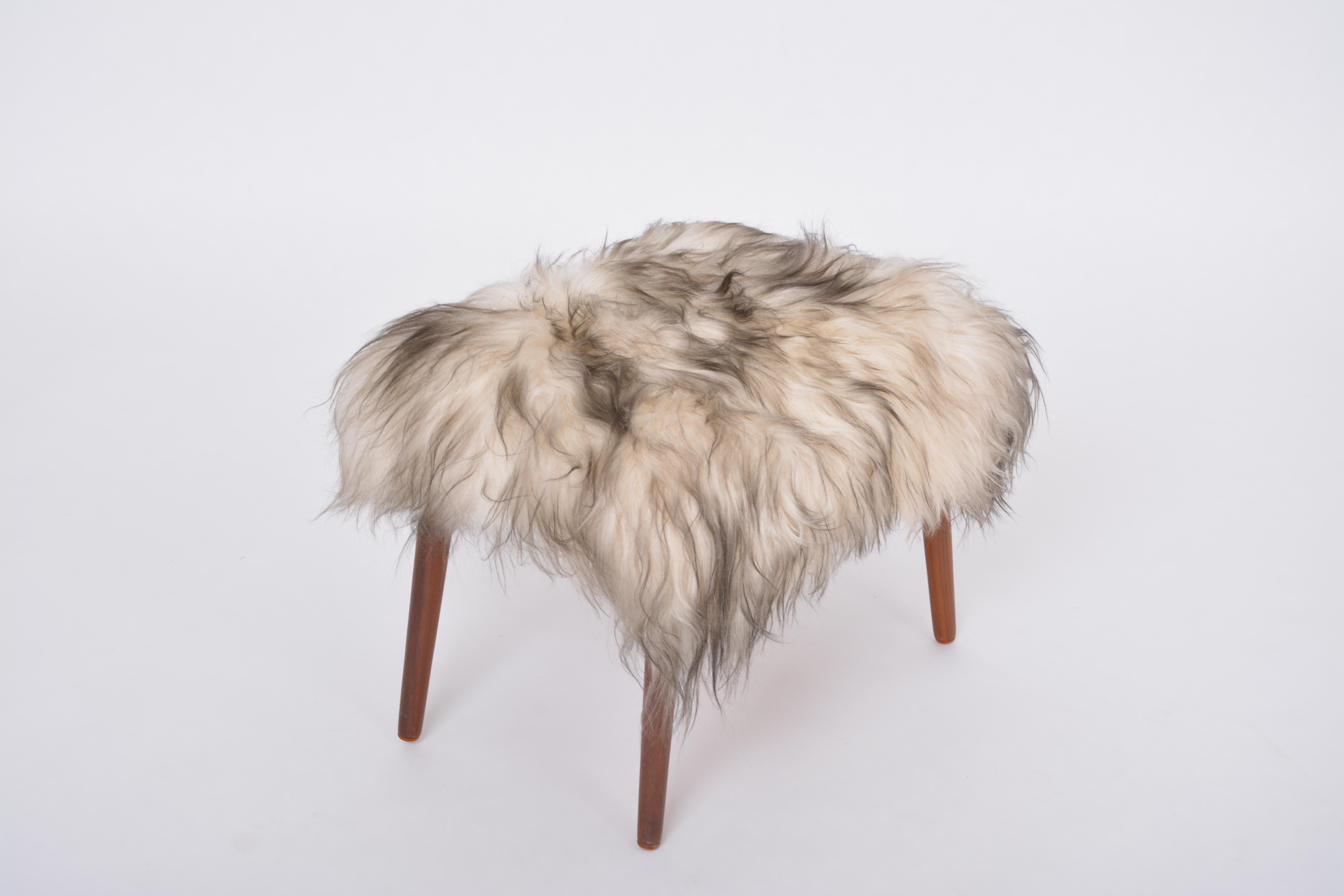20th Century Danish Mid-century Modern stool reupholstered in white and black sheep skin For Sale