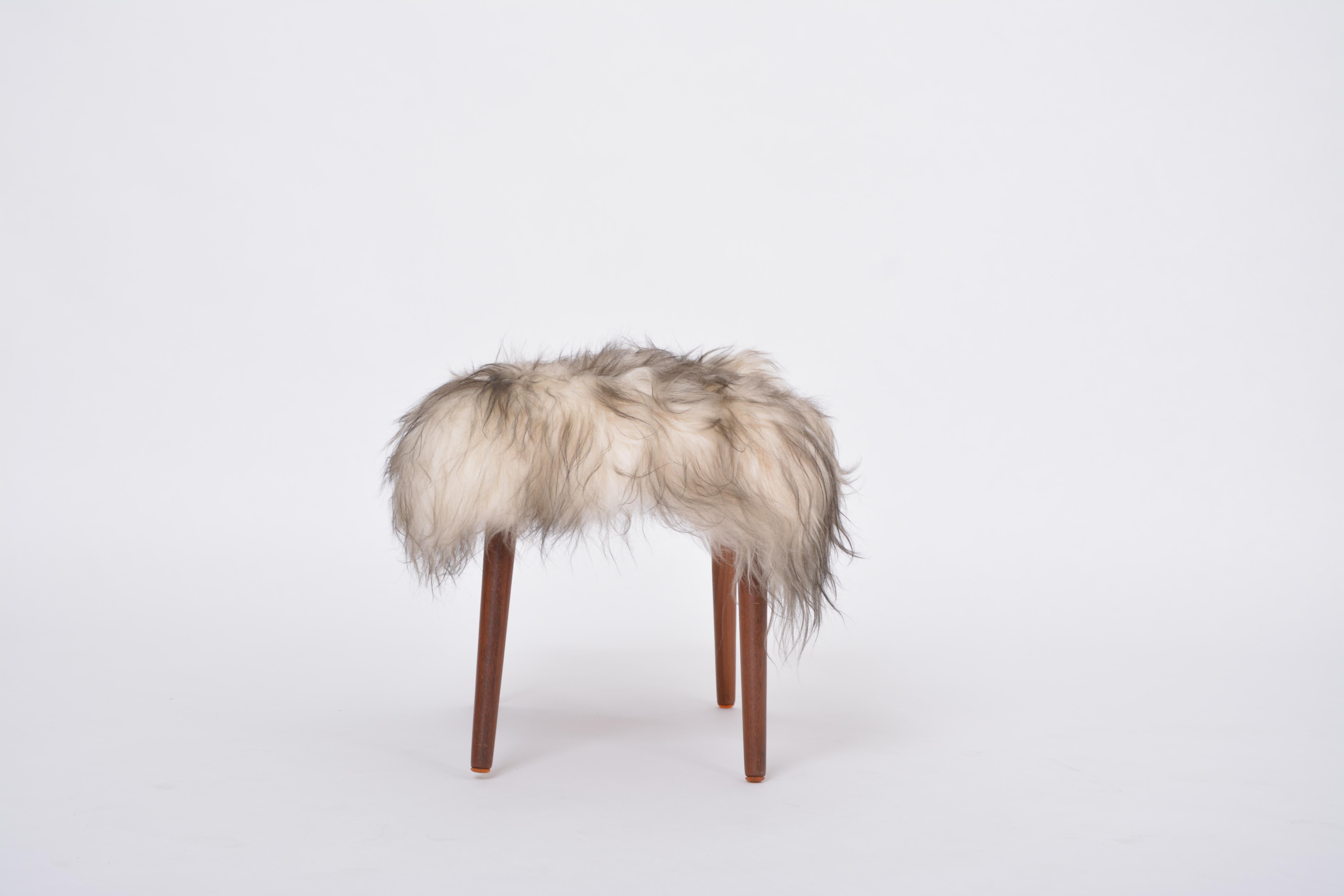 Sheepskin Danish Mid-century Modern stool reupholstered in white and black sheep skin For Sale