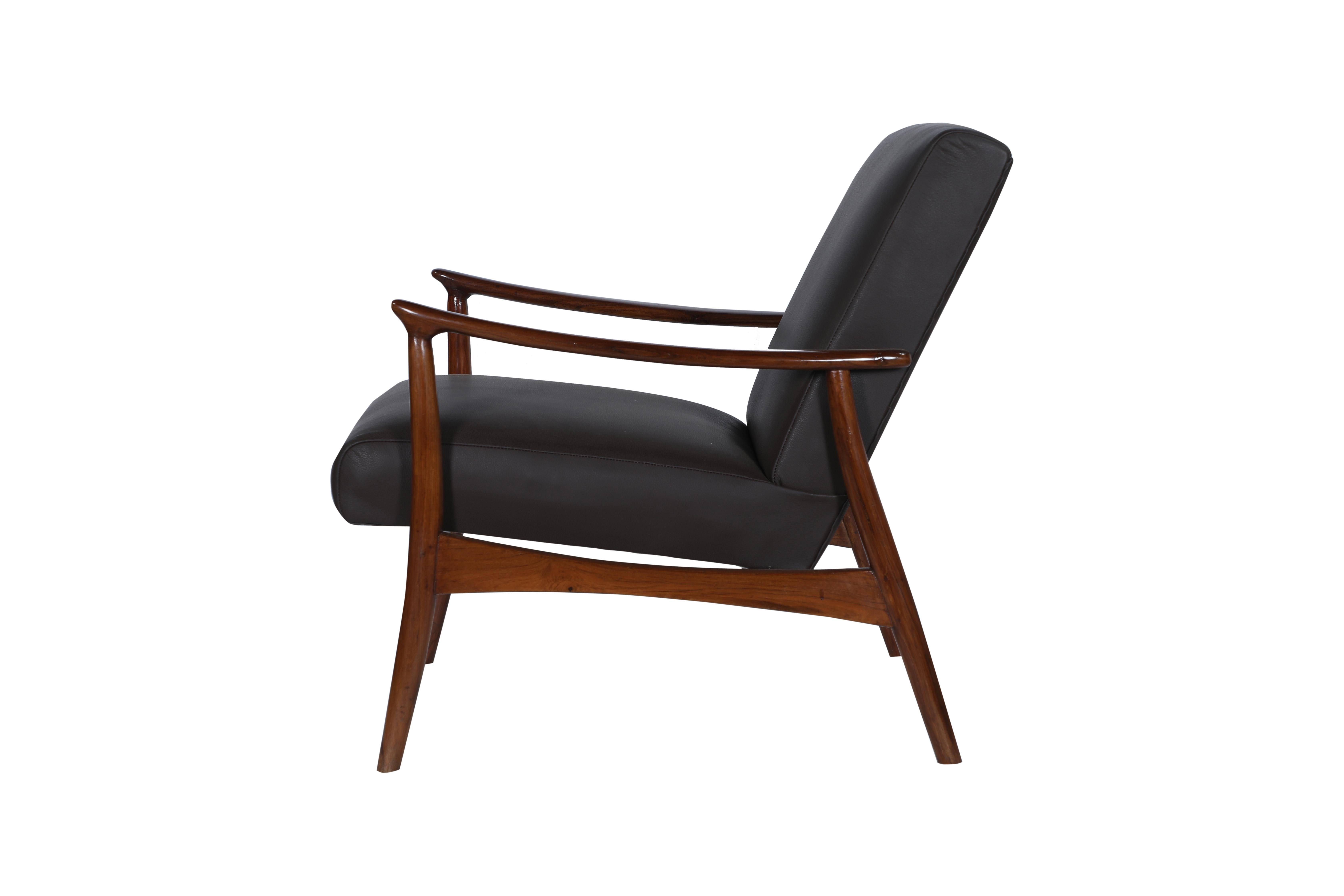 A handsome and elegant Danish Mid-Century Modern teak club or side chair. The dark brown leather has been replaced and the chair refinished. Great lines and style and very comfortable.