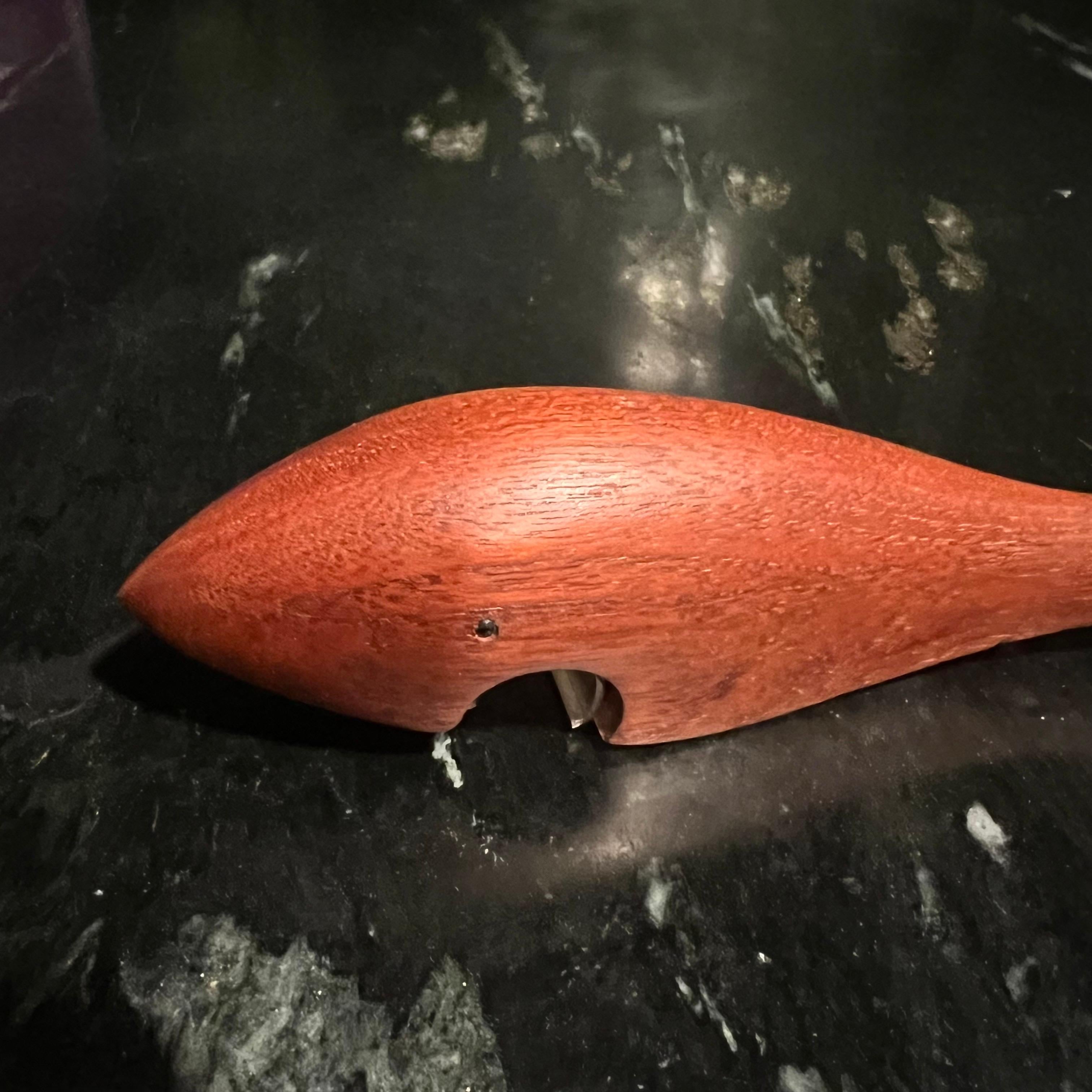 Fantastic mid century teak shark bottle opener by Arne Basse of Denmark. The Danish modern collectible is handsome accessory for your bar, kitchen, or desk. Wonderful collectible and house warming gift! Stamped on underside 