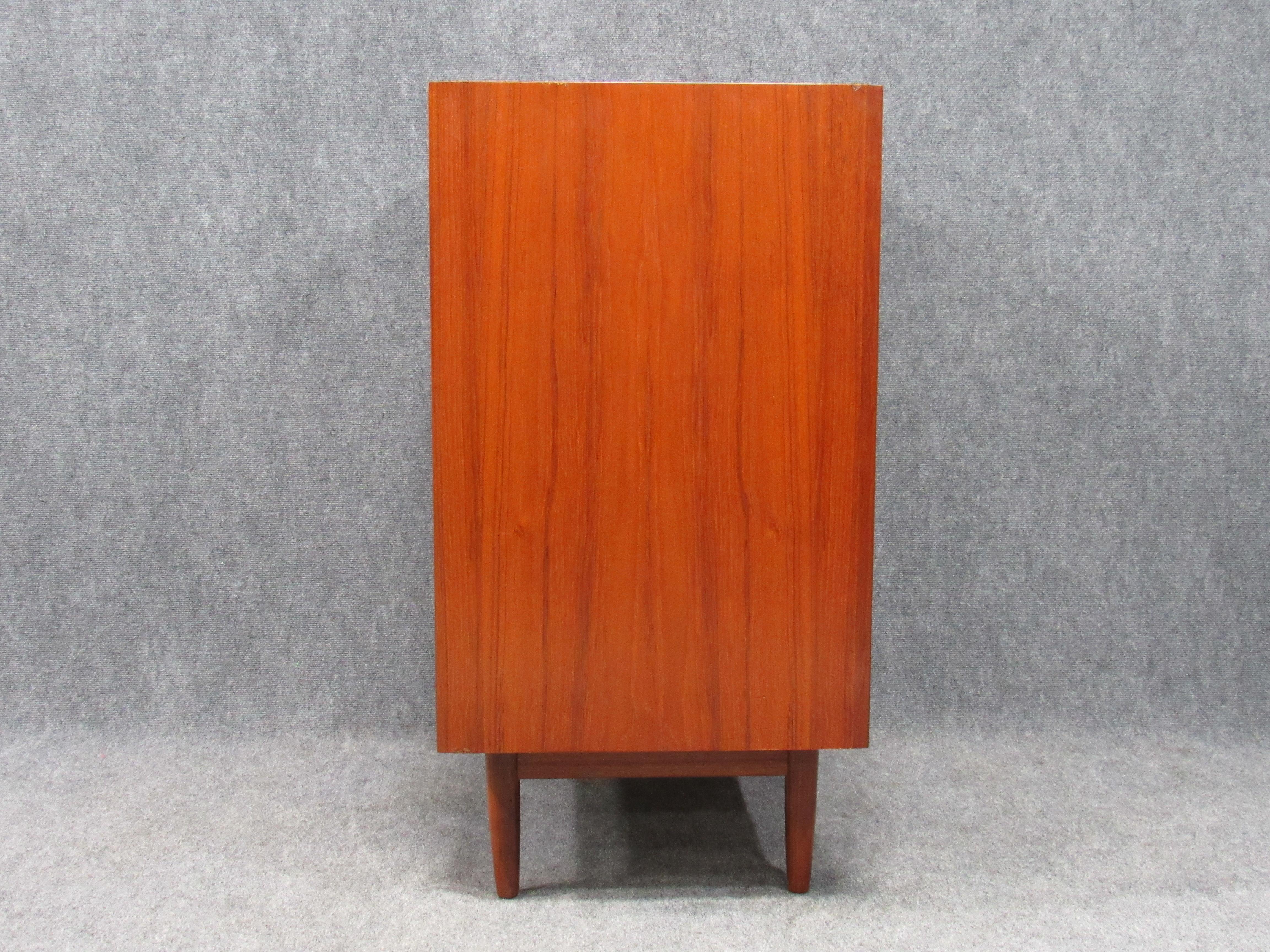 Danish Mid-Century Modern teak chest of drawers dresser with fully finished back.