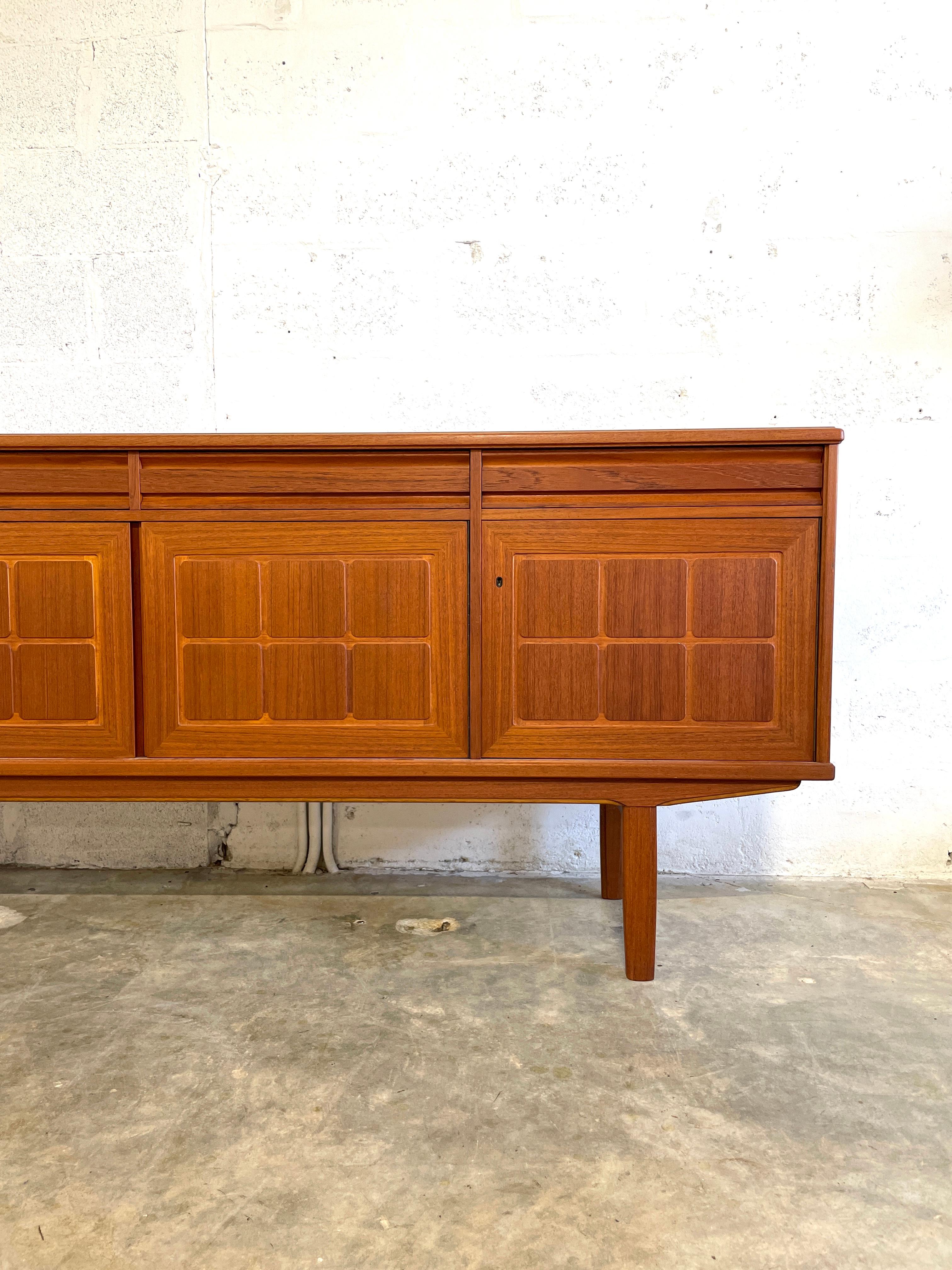 Danish Modern Credenza with carved detail on front doors.