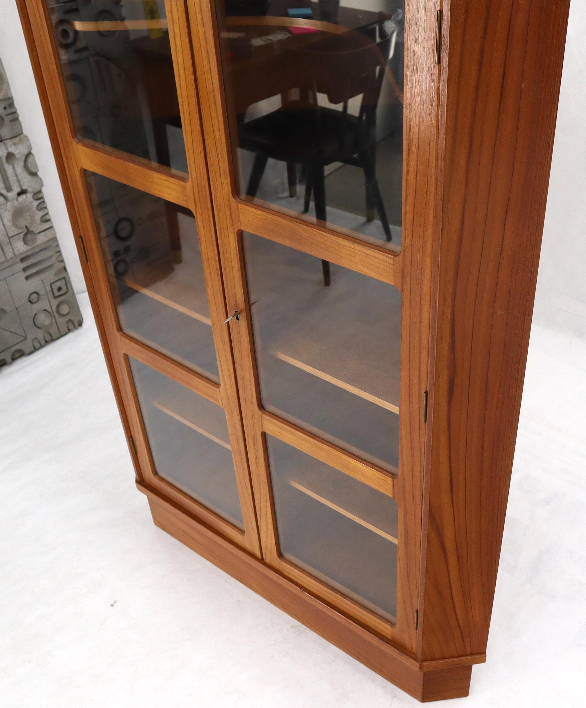 Super clean midcentury Danish Modern teak corner cabinet with adjustable shelves.