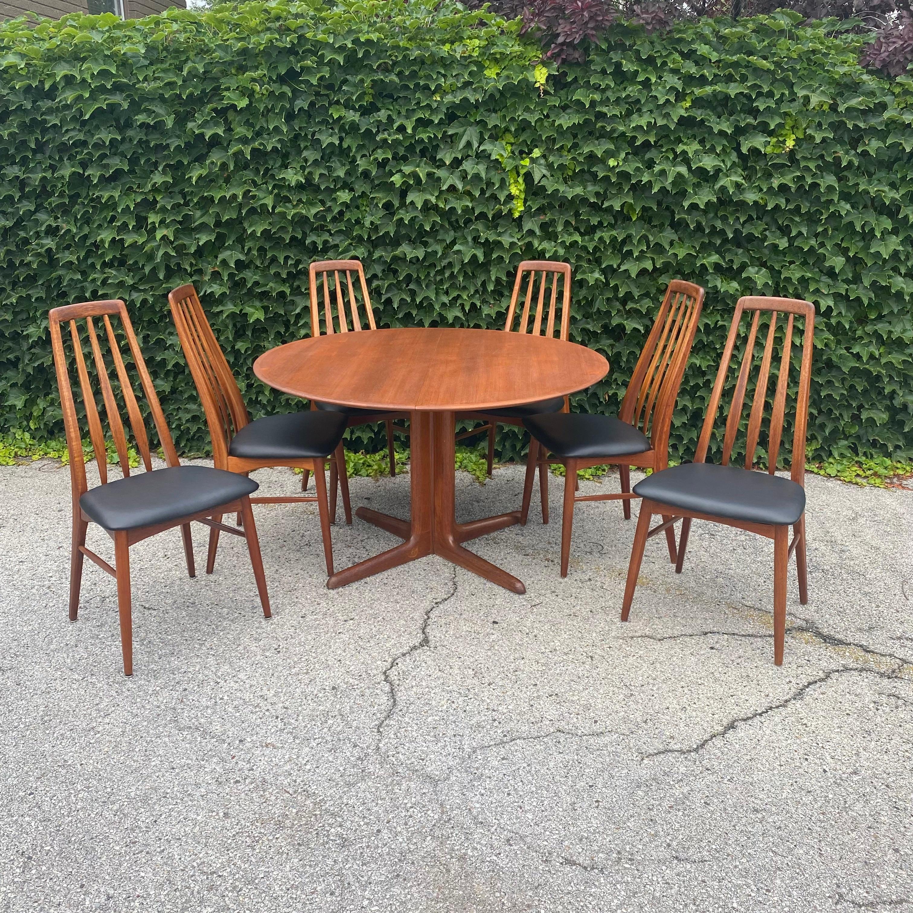 Slender lines and honeyed teak, this vintage dining set is stylish and sturdy. Made by Dyrlund-Smith A/S, this is an authentic Danish Modern table. We love her chic pedestal base which separates cleanly to allow for extra seating. Freshly refinished