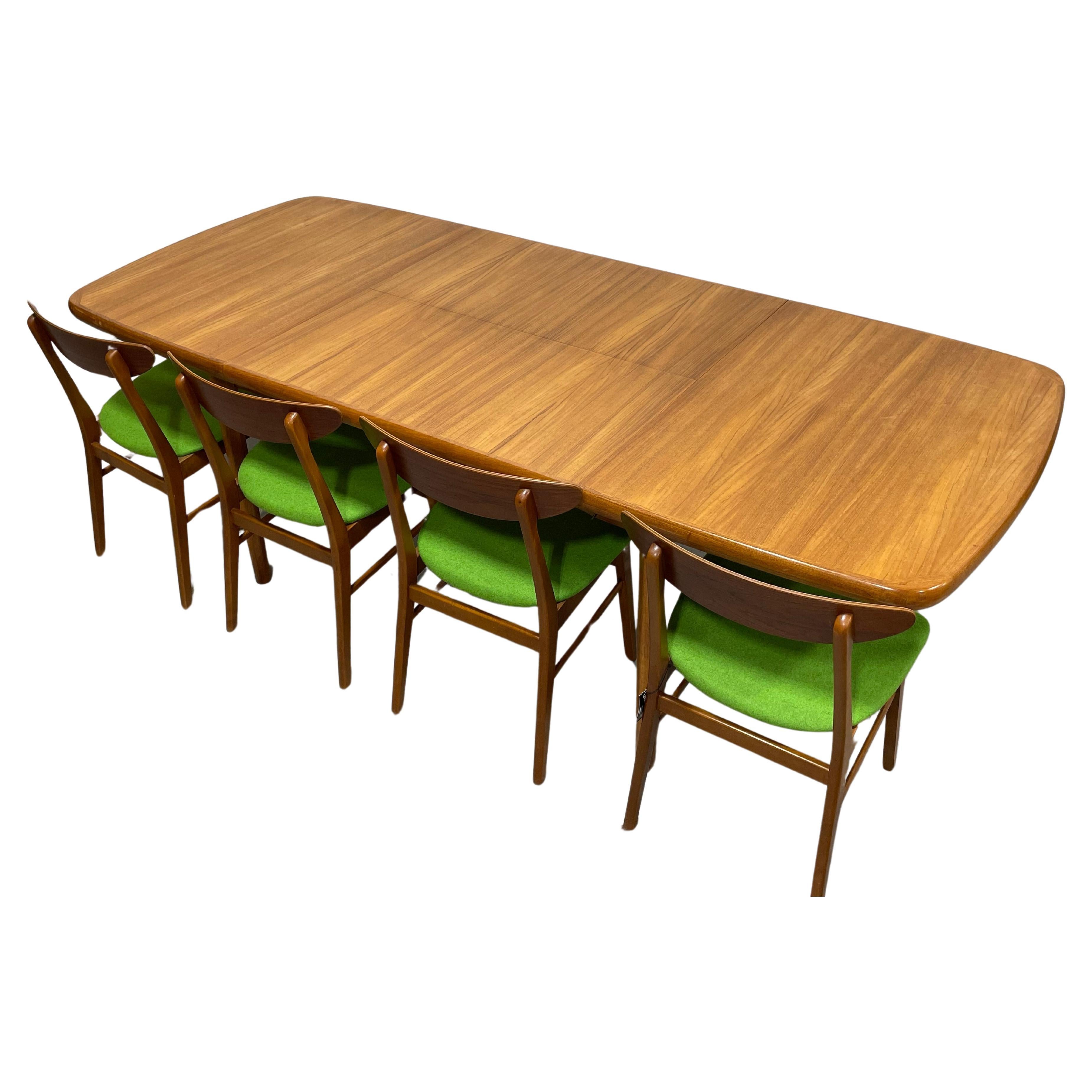 Danish Mid Century Modern Teak Dining Table, Stamped AM 56, circa 1960’s. This incredible table easily expands from an apartment friendly 55” to 92.5” one the hidden butterfly leaf flips  open from underneath the tabletop when you need additional