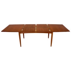 Vintage Danish Mid-Century Modern Teak Dining Table with Two Pop Up Self Storing Leaves