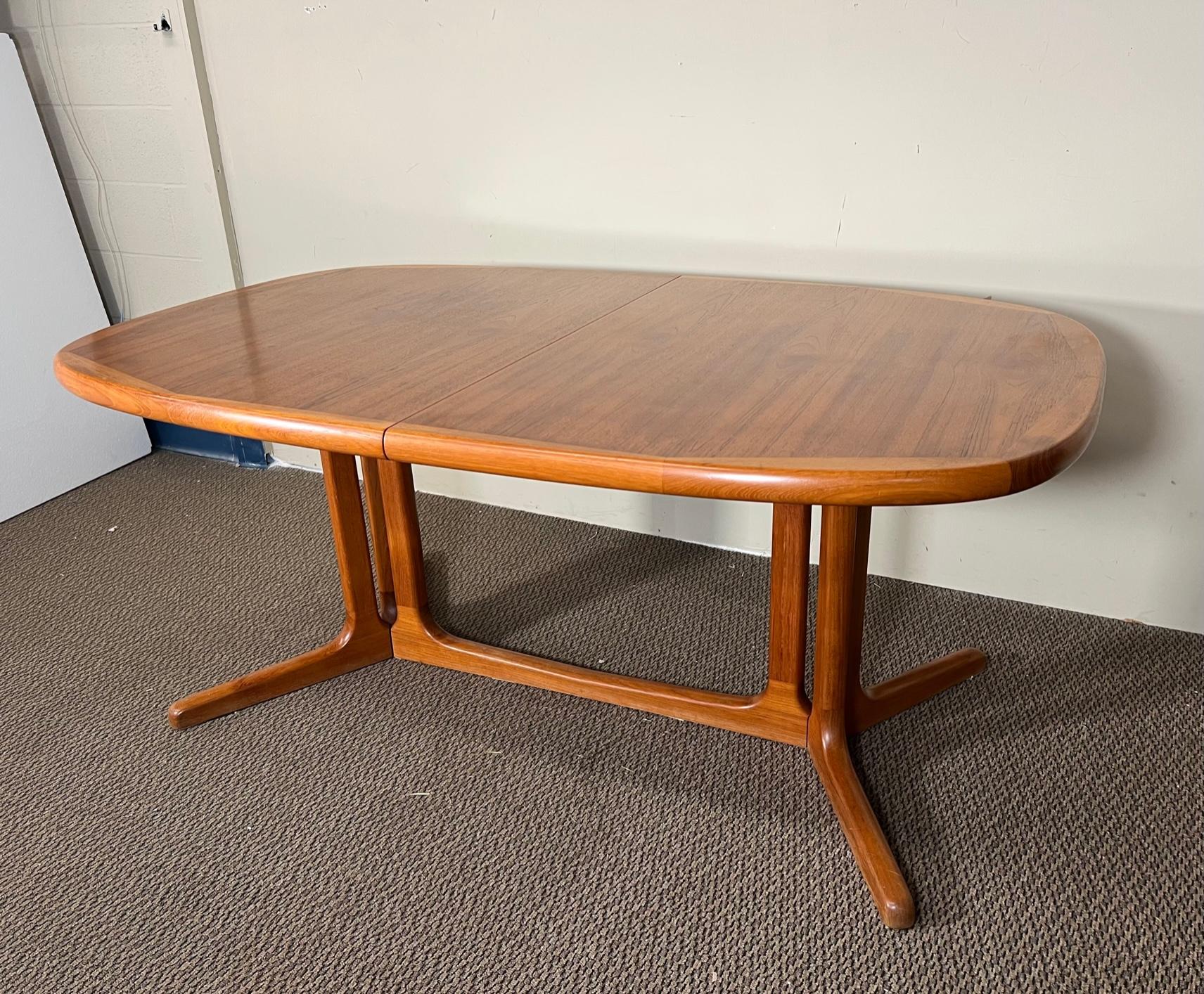 This is a Danish teak dining table with 2 extension leaves. Leaves can be stored inside the table when not in use. 
Very nice condition overall. Some loss of finish on the table top. Scratches on one leaf. The leaves are slightly darker than the