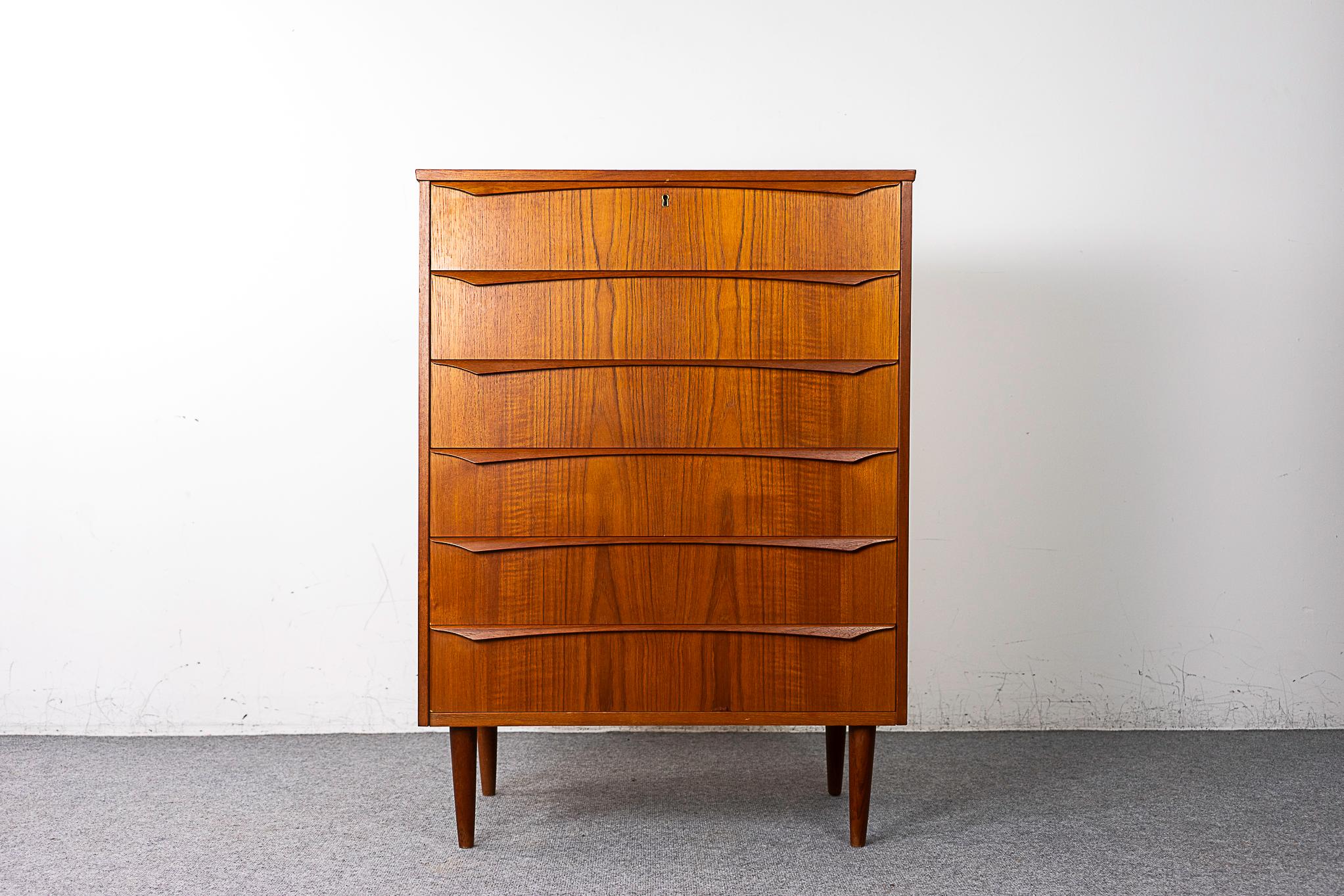 Teak Danish dresser, circa 1960's. Stunning book-matched veneer top, sides and drawer faces. Integrated, horizontal drawer pulls and dovetail construction. Sleek tapering legs!

Please inquire for remote and international shipping rates.