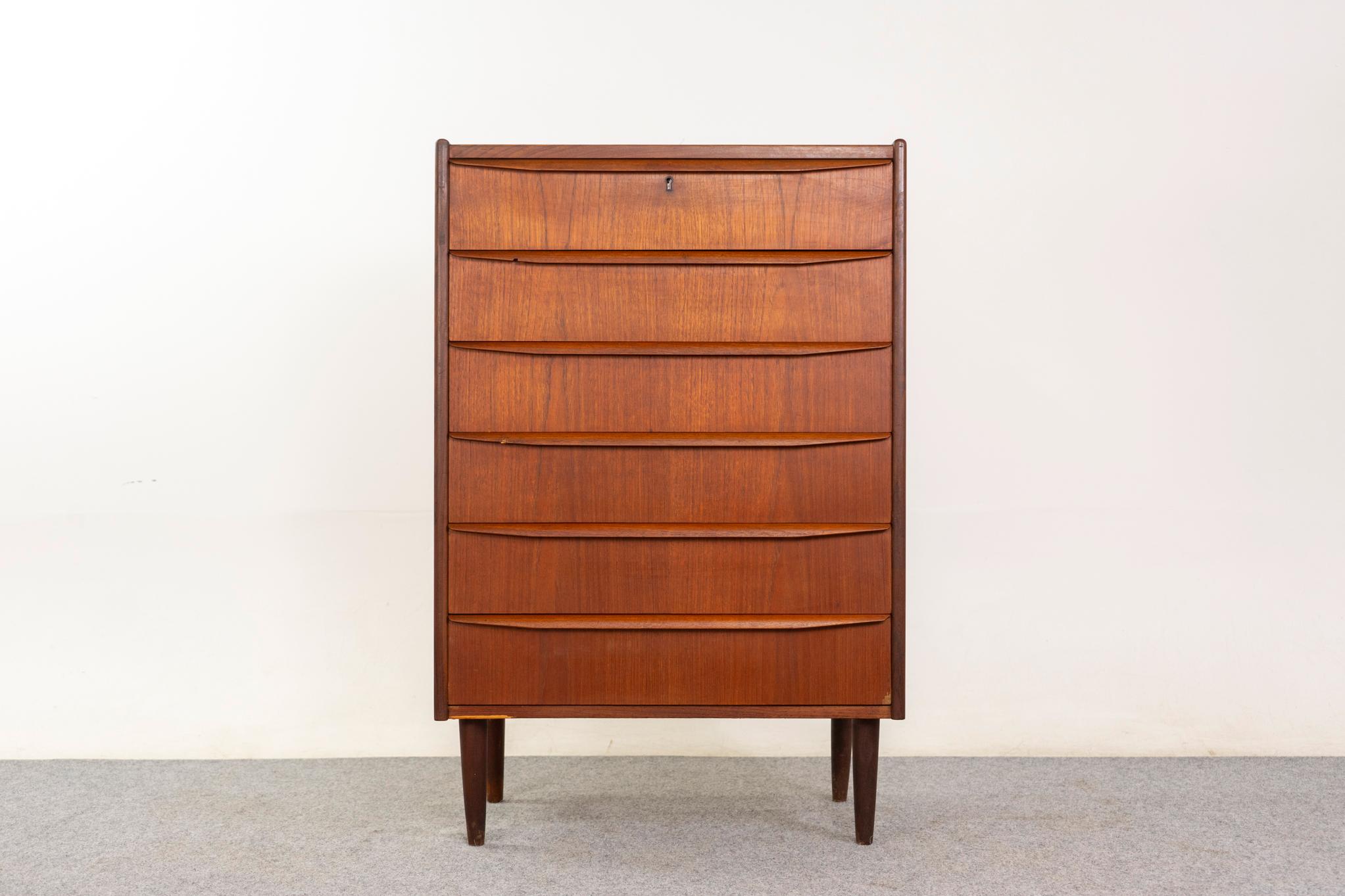 Teak high boy dresser, circa 1960's. Solid wood edging and stunning book matched veneer. Integrated, sleek handles and contrasting tapered legs.  

Unrestored item with option to purchase in restored condition for an additional $250 USD. Restoration