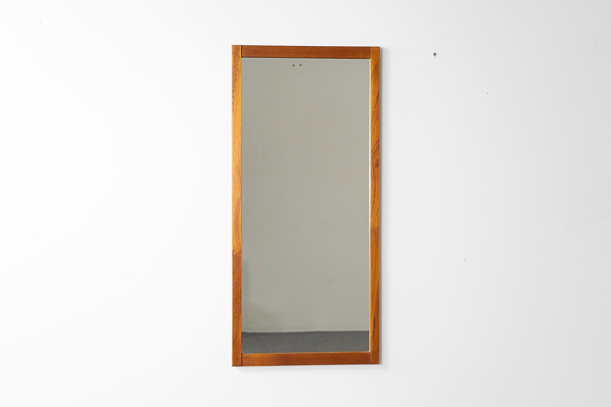 Teak mid-century mirror, circa 1960's. Solid wood frame with nice patina, original glass is in nice condition! 

Please inquire for remote and international shipping rates.