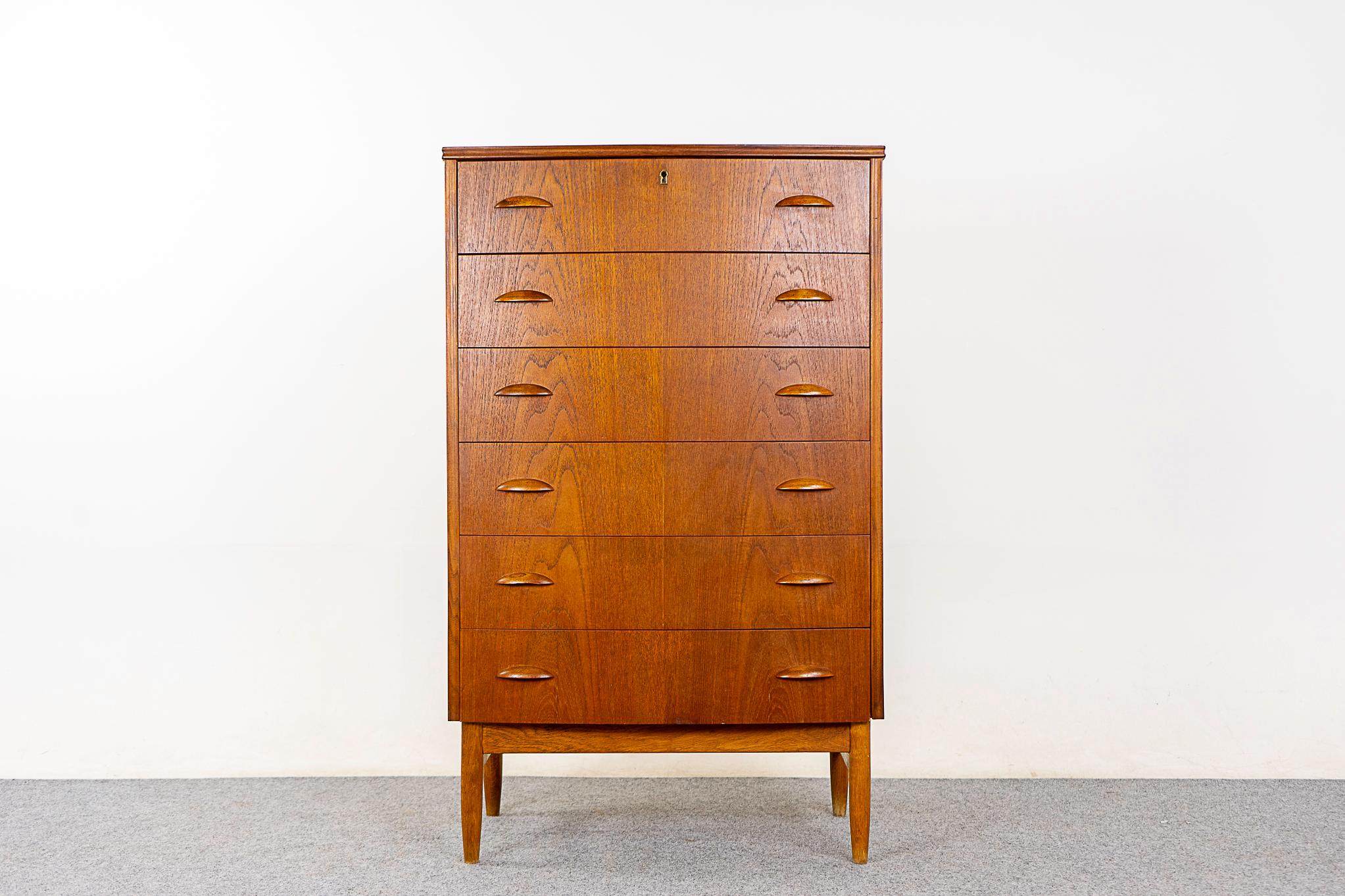 Teak Danish highboy dresser, circa 1960's. Gentle curvaceous bow front with stunning book-matched drawer faces. Contrasting oak base with elegant crossbars. 

Please inquire for remote and international shipping.